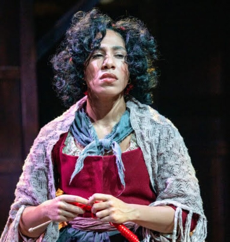 Luisa Turner plays Madame Defarge, a vengeful leader of the French Revolution who knits death warrants for aristocrats.
