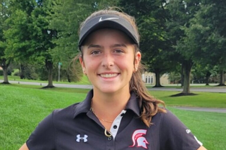 Megan Kirkpatrick poses for a photo after her 5-under par round of 32 points at Cattail Creek on Thursday.