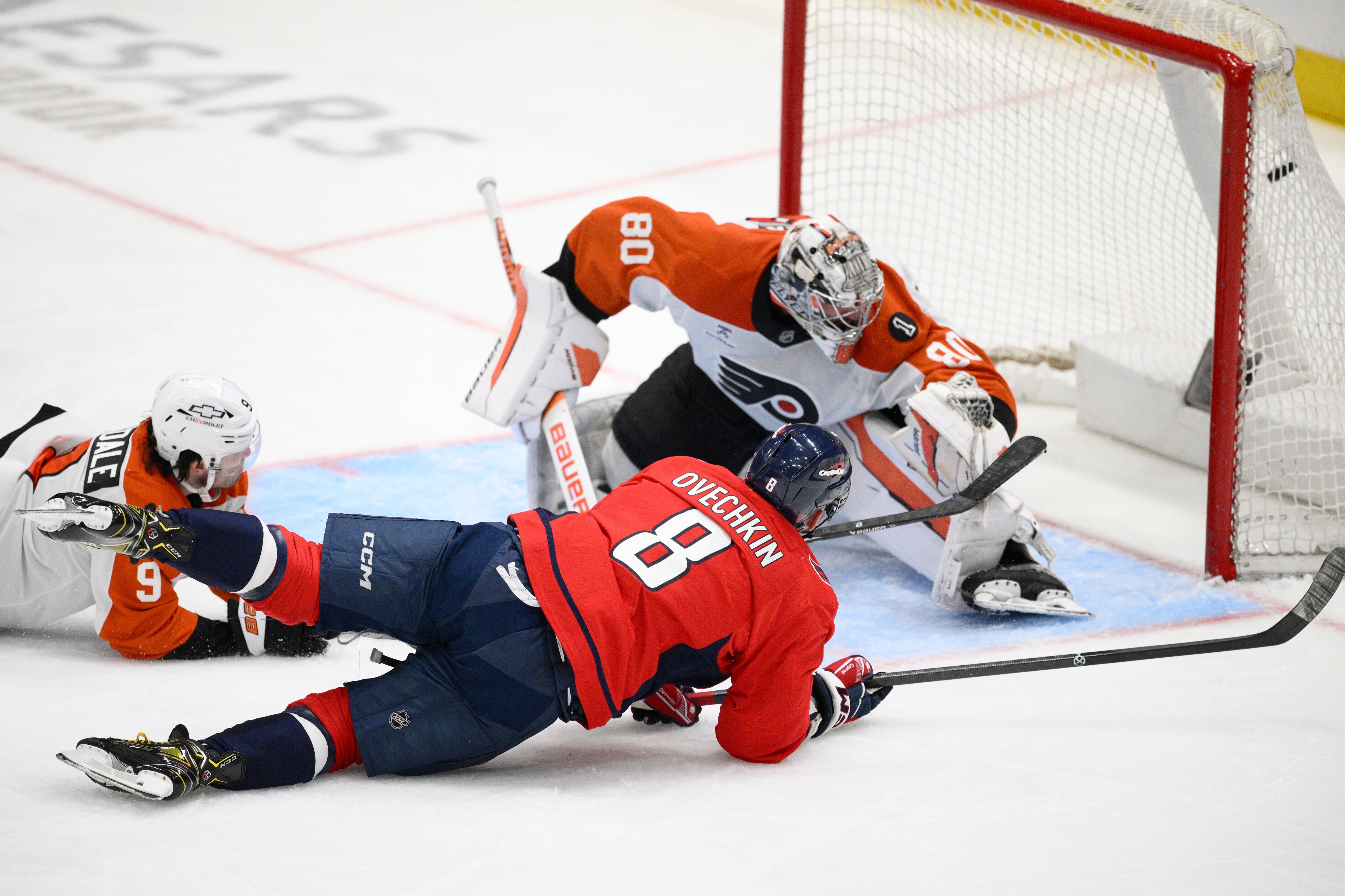 Washington Capitals left wing Alex Ovechkin (8) scores a goal past Philadelphia Flyers goaltender Dan Vladar (80) and defenseman Jamie Drysdale (9) during the third period.