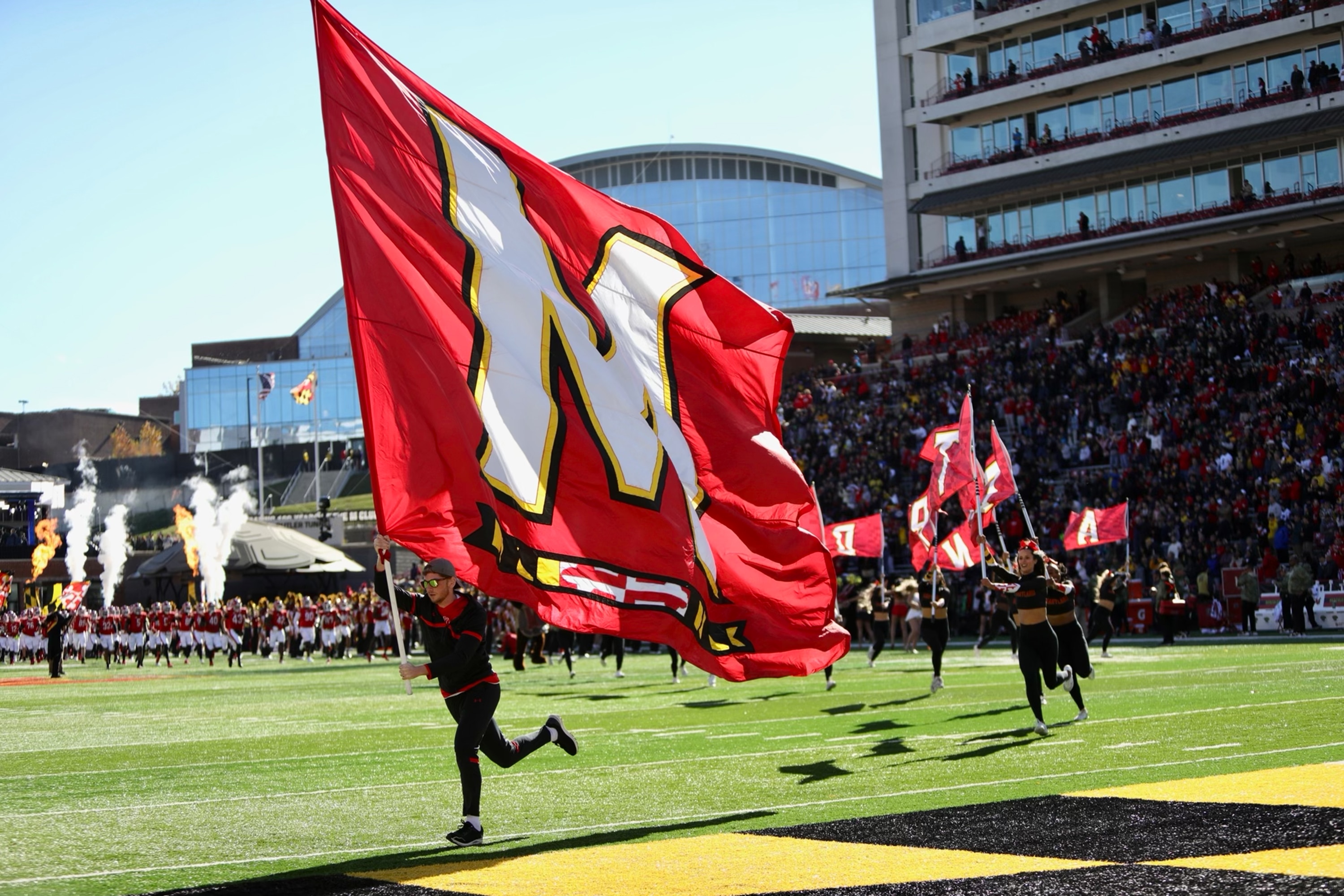 An indictment and warrant were issued for a man’s arrest late last month after he allegedly stole cash and luxury sunglasses from the University of Maryland football team.