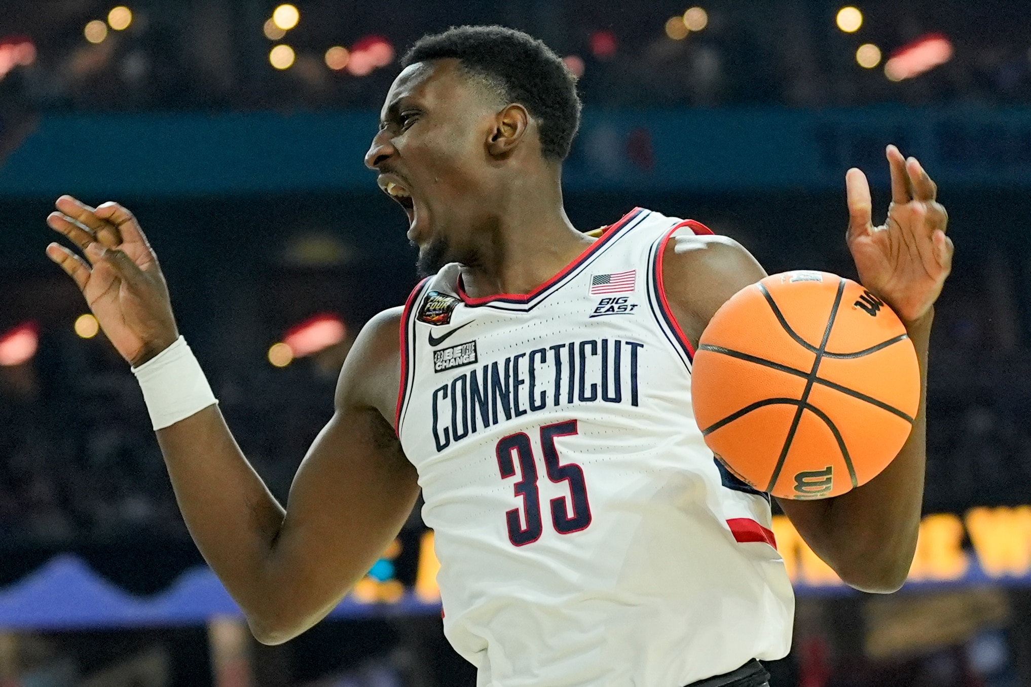 UConn forward Samson Johnson celebrates a basket against Alabama in the national semifinals.