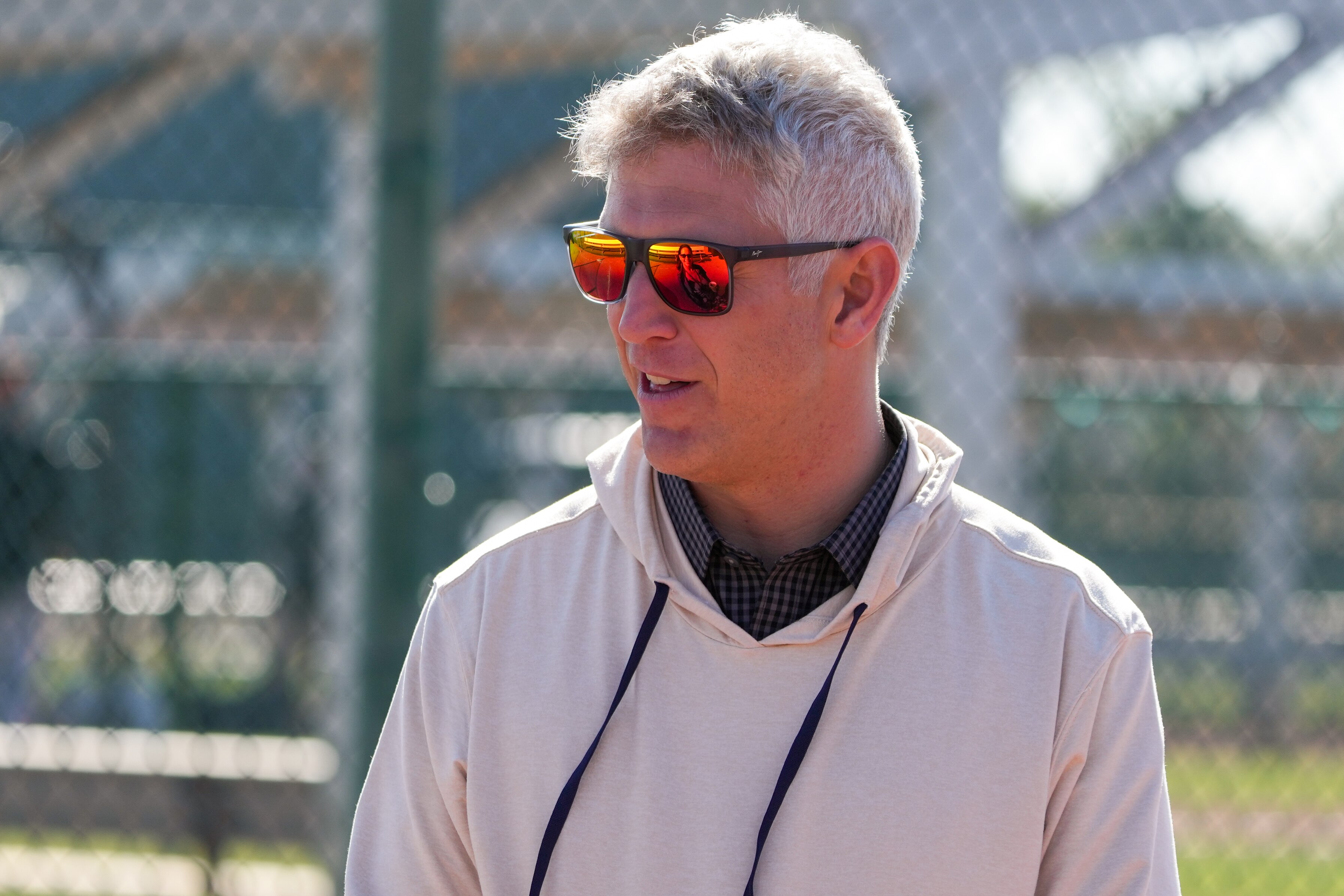 Baltimore Orioles general manager Mike Elias speaks with other management during the team’s spring training session at Ed Smith Stadium on Feb. 23, 2024.