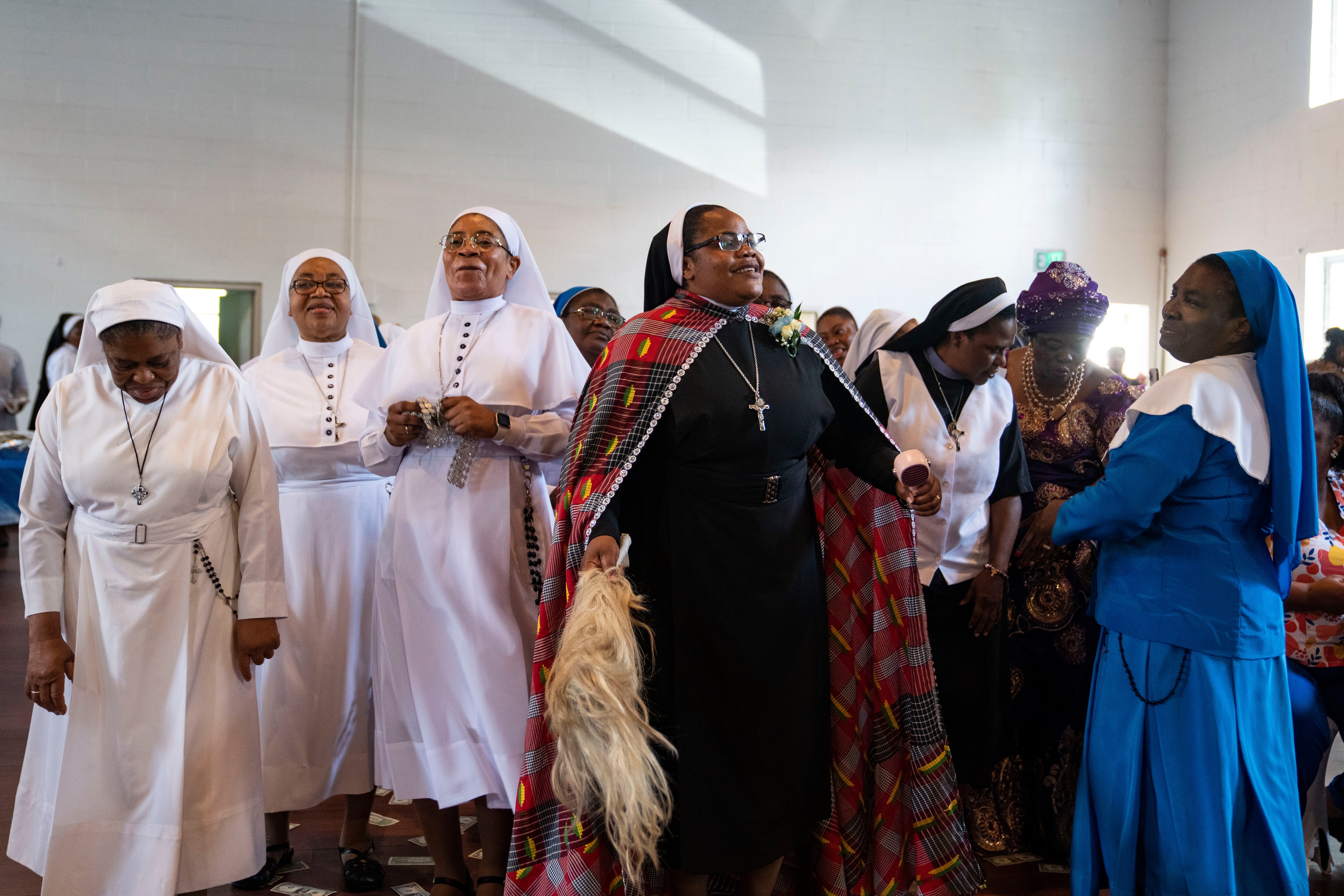 Sister Delphine Okoro enters a lunch after her Rite of Perpetual Profession at Our Lady of Mount Providence Convent, in Arbutus, MD, Thursday, August 14, 2025.