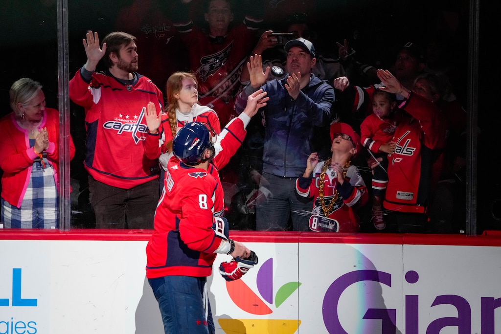 Washington Capitals left wing Alex Ovechkin (8) throws a puck to fans as he is recognized as a Star of the Game after beating the Pittsburgh Penguins in an NHL match at Capital One Arena in Washington, D.C. on Sunday, April 12, 2026.