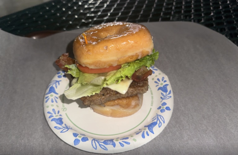 The Krispy Kreme burger sandwiches a beef patty, melted cheese, lettuce, tomato and bacon between two glazed donuts was worse. It was one of many food offerings at the Montgomery County Agricultural Fair on Aug. 14, 2026.