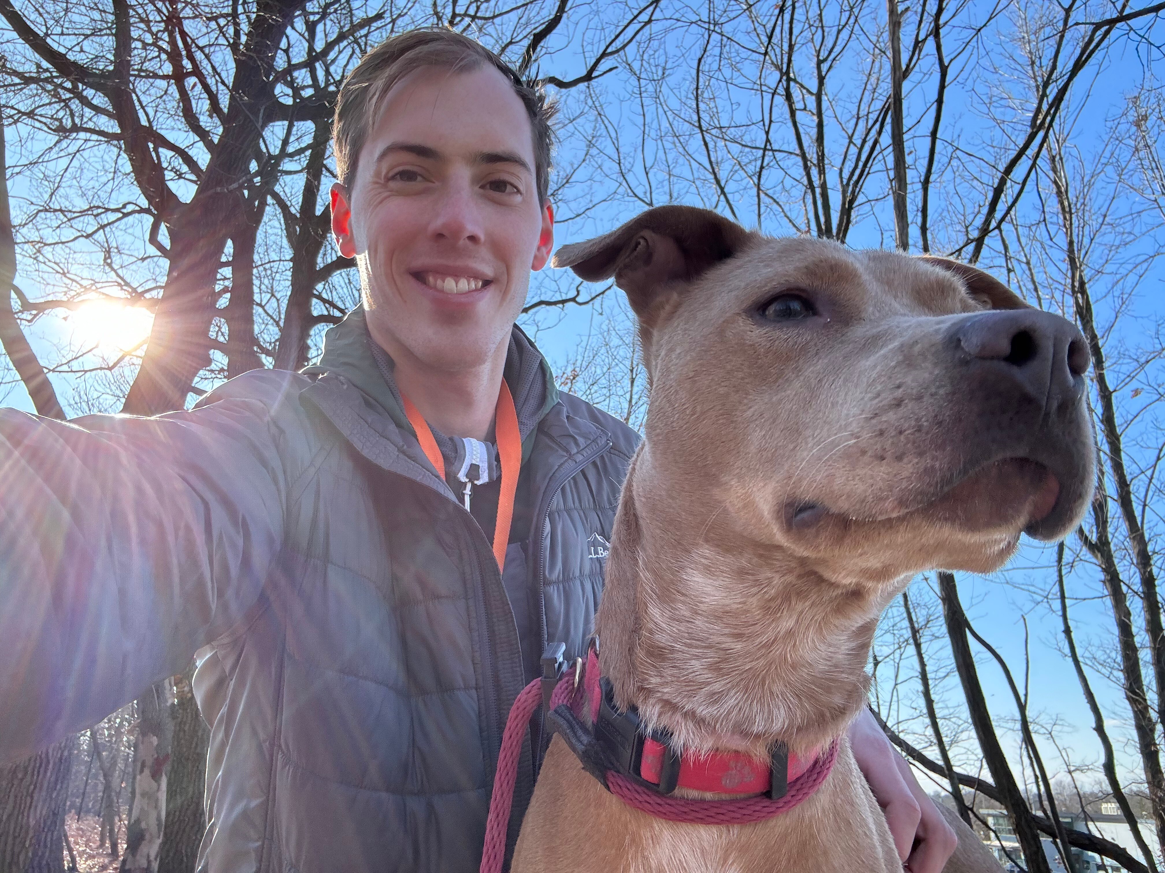 Andy Kostka takes a selfie with Jumping Bean, a dog at BARCS.