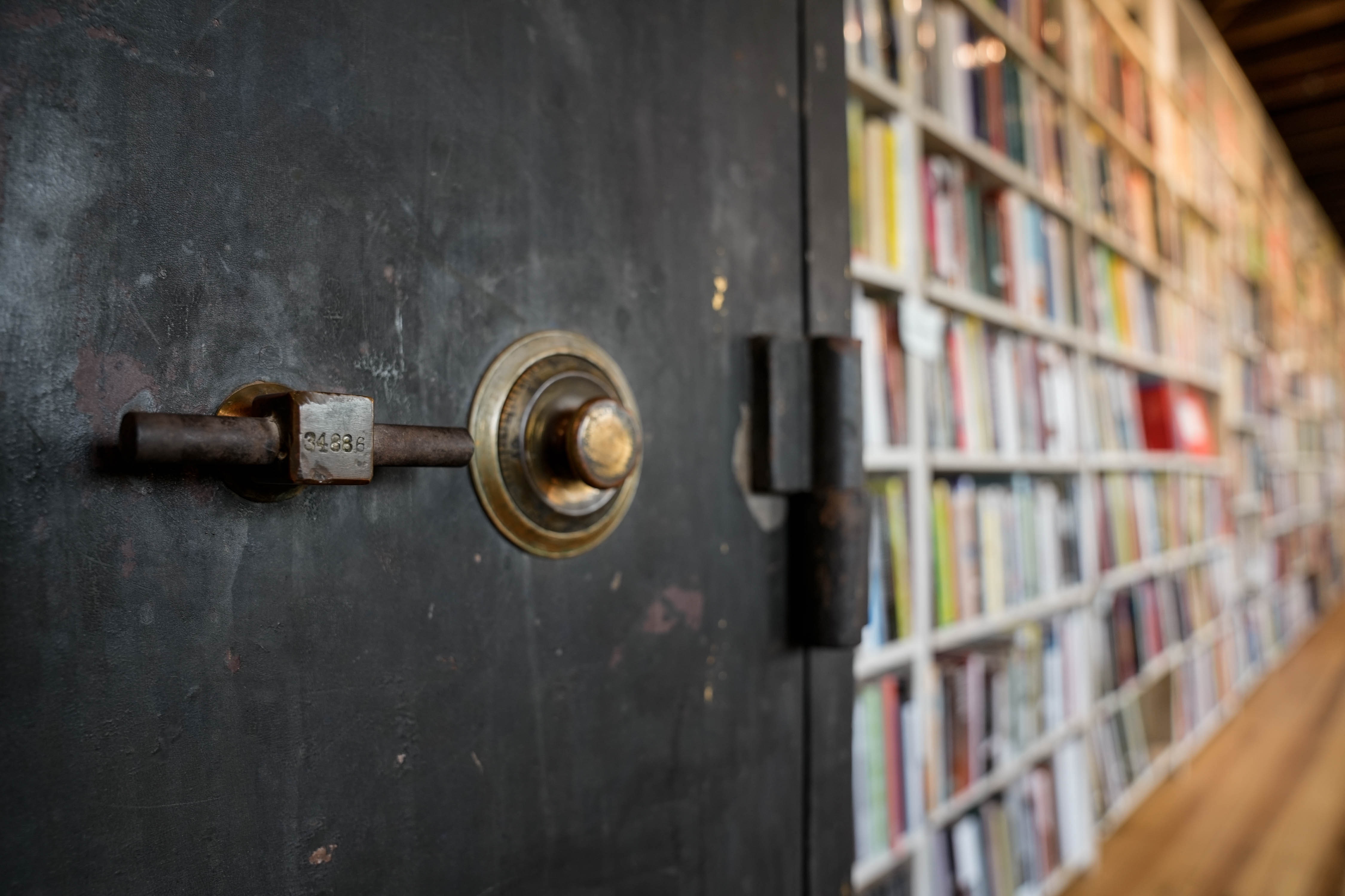 The locked safe sits among books on the second floor of Red Emma's on July 6, 2023.