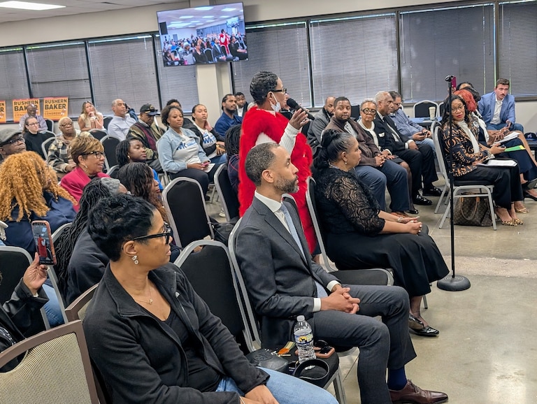An audience member asks a question of congressional candidates for the 5th District at the South County Democratic Club on May 3, 2026.