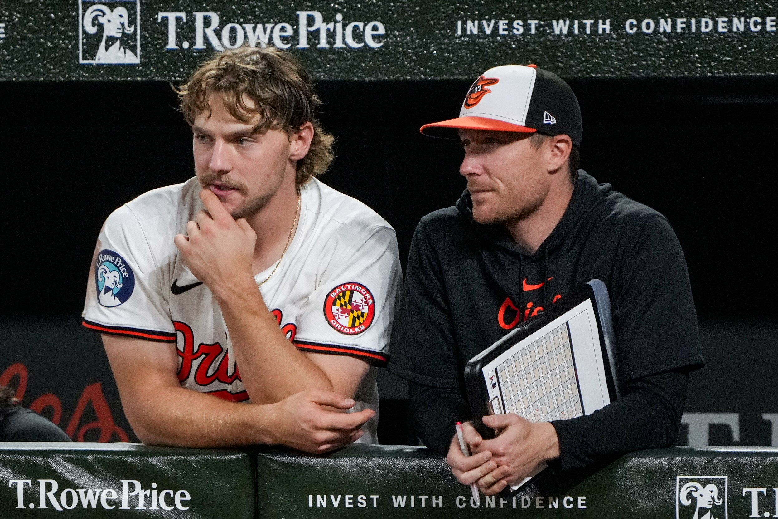 Orioles shortstop Gunnar Henderson and offensive strategy coach Cody Asche watch from the dugout during the game against the White Sox on Wednesday night.