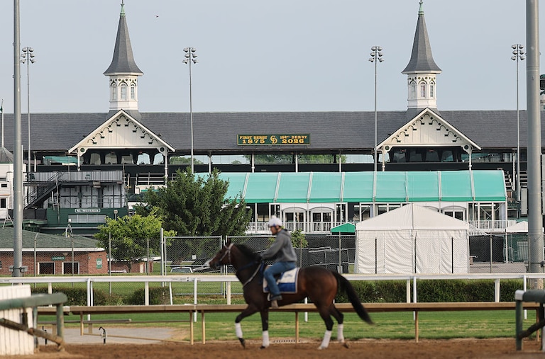 Horses train beneath the twin spires during morning workouts ahead of the running of the 152nd Kentucky Derby.