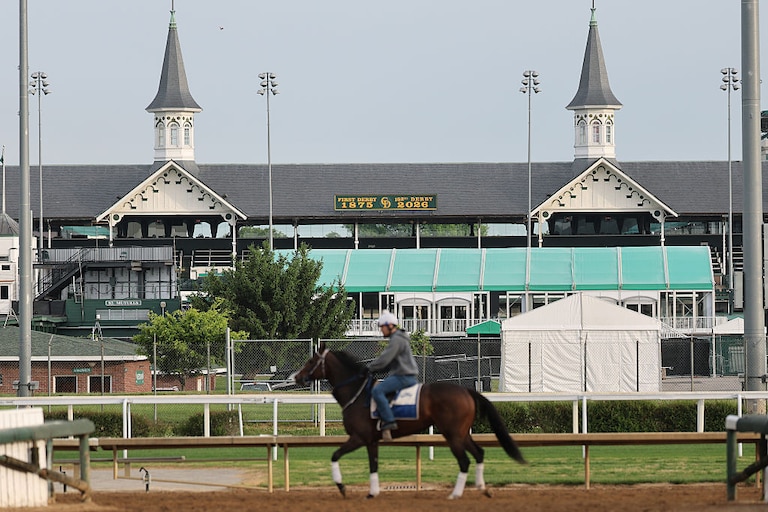 Horses train beneath the twin spires during morning workouts ahead of the running of the 152nd Kentucky Derby.
