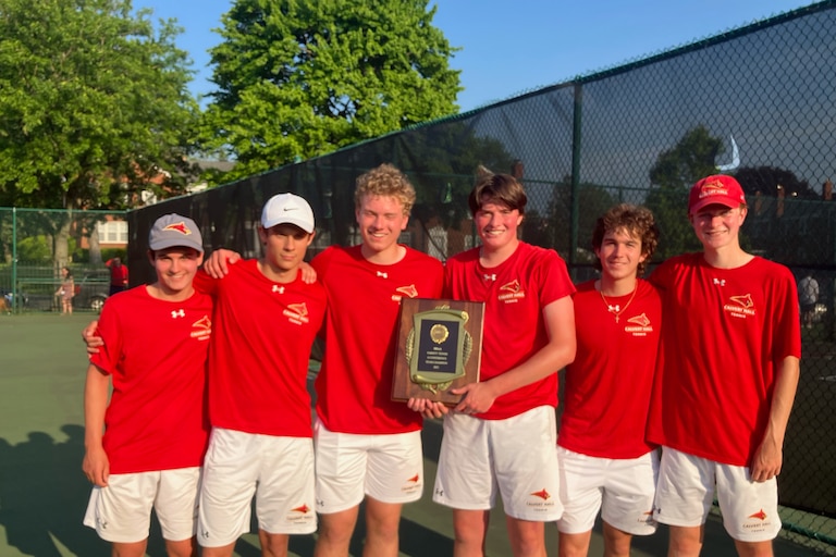 The Calvert Hall tennis team shows off its MIAA A Conference championship plaque after defeating perennial league power Gilman, 3-2, in Thursday's league championship match.