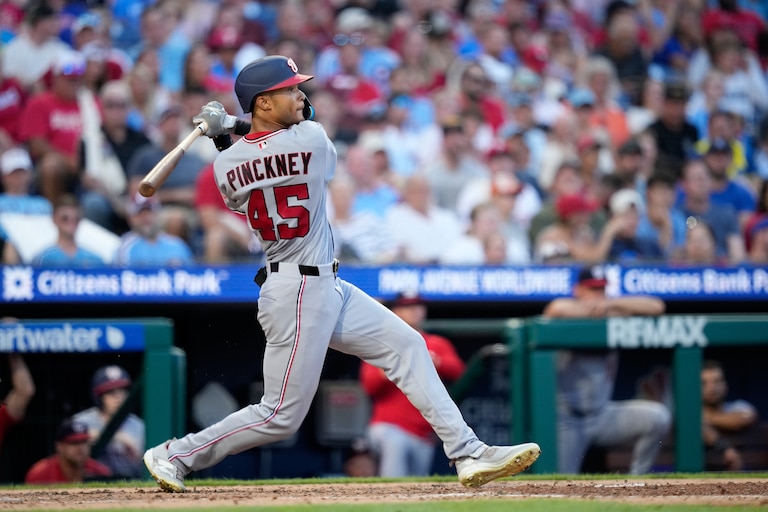 Washington Nationals' Andrew Pinckney follows through after hitting a home run against Philadelphia Phillies pitcher Cristopher Sánchez during the fourth inning of a baseball game Thursday, Aug. 6, 2026, in Philadelphia. (AP Photo/Matt Slocum)