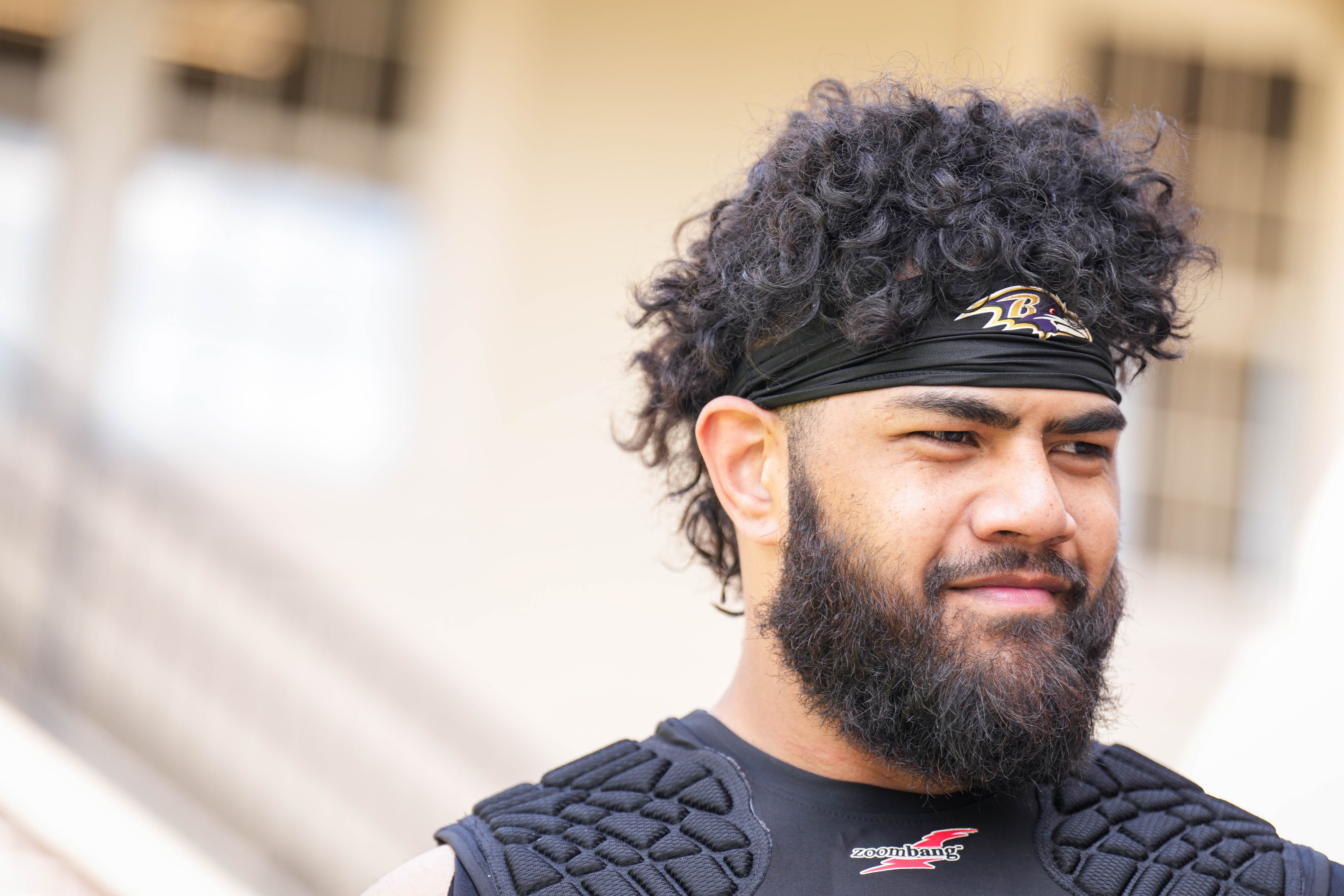Ravens rookie guard Vega Ioane takes questions from reporters following rookie minicamp practice on May 2.