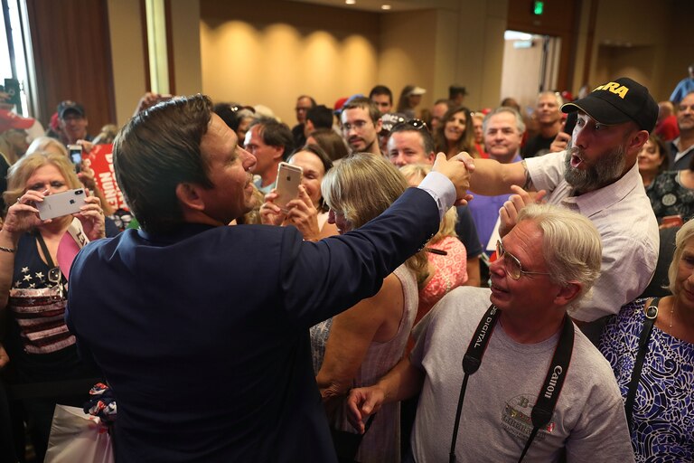 WEST PALM BEACH, FL - OCTOBER 06: Republican gubernatorial candidate Ron DeSantis greets people as he holds a campaign rally at the Palm Beach County Convention Center on October 6, 2018 in West Palm Beach, Florida. DeSantis is facing off against Democratic challenger Andrew Gillum to be the next Florida governor.