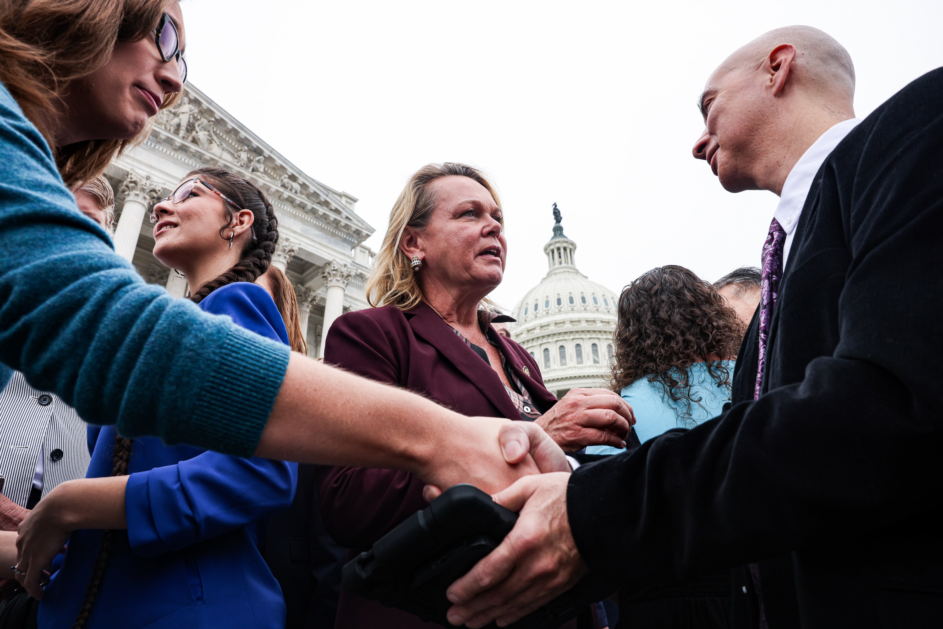 Rep. April McClain Delaney, center, along with other local, state and federal officials, is offering support for federal workers who have been affected by the government shutdown. 