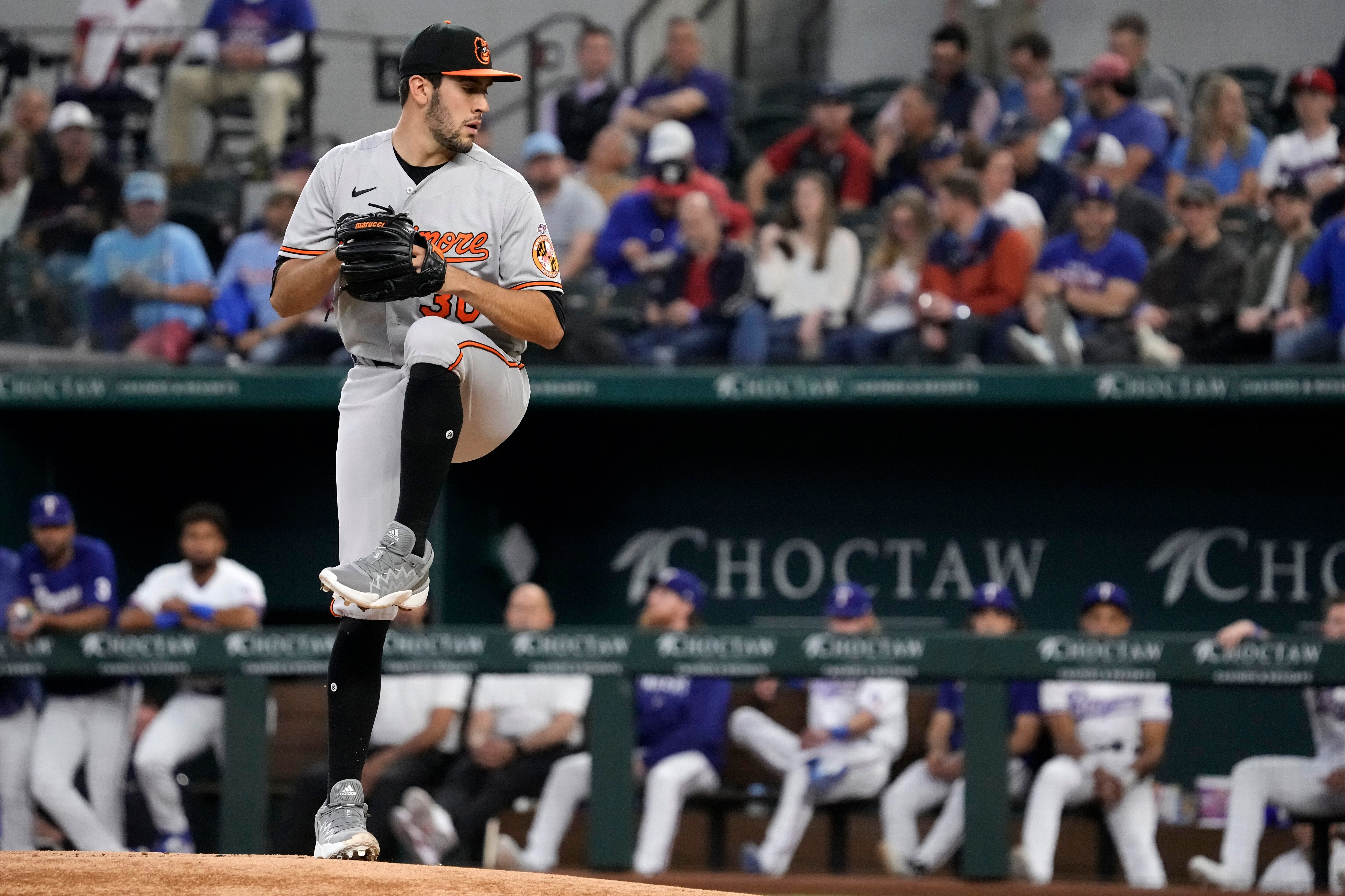 Grayson Rodriguez #30 of the Baltimore Orioles prepares to throws a pitch during the first inning of his Major League debut against the Texas Rangers at Globe Life Field on April 05, 2023 in Arlington, Texas.