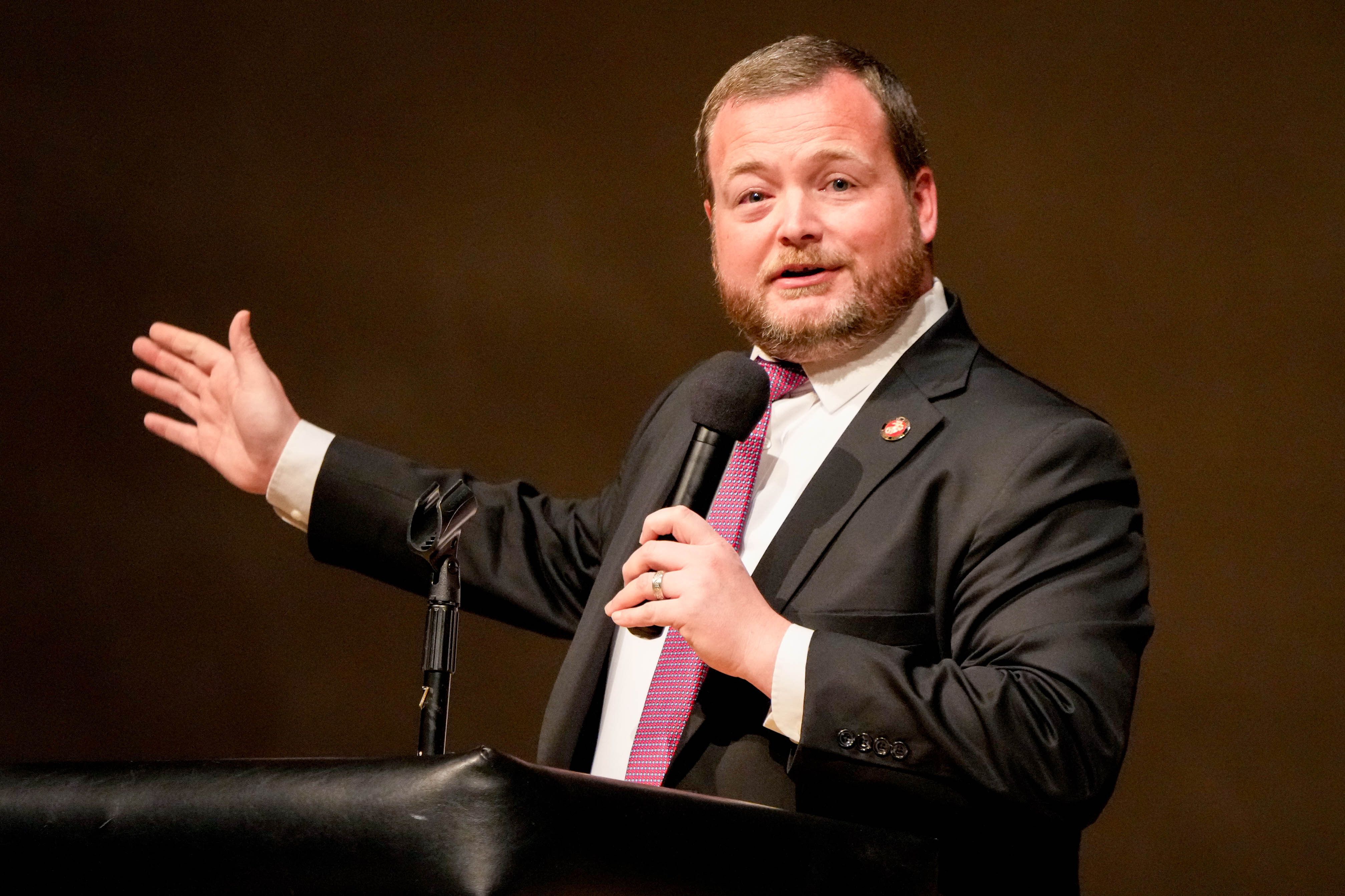 Baltimore County councilman Pat Young moderates a congressional town hall meeting at Woodlawn High School in Woodlawn, Md. on Thursday, March 20, 2025.