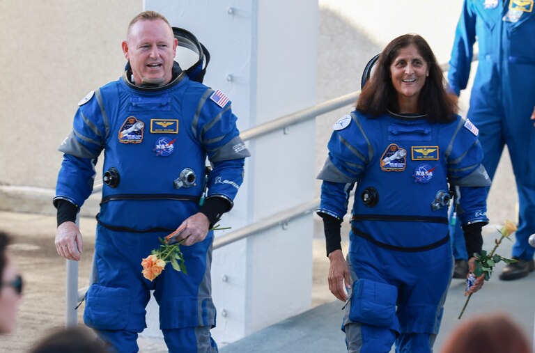 CAPE CANAVERAL, FLORIDA - JUNE 05: NASA’s Boeing Crew Flight Test Commander Butch Wilmore (L) and Pilot Suni Williams walk out of the Operations and Checkout Building on June 05, 2024 in Cape Canaveral, Florida. The astronauts are heading to Boeing’s Starliner spacecraft, which sits atop a United Launch Alliance Atlas V rocket at Space Launch Complex 41 for NASA’s Boeing crew flight test to the International Space Station. (Photo by Joe Raedle/Getty Images)