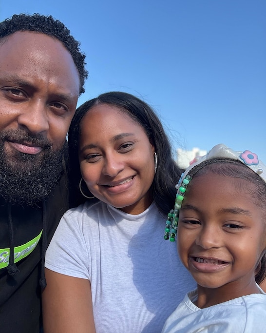 Robert Stokes Jr., left, with his wife Kristal Stokes and their 5-year-old daughter.