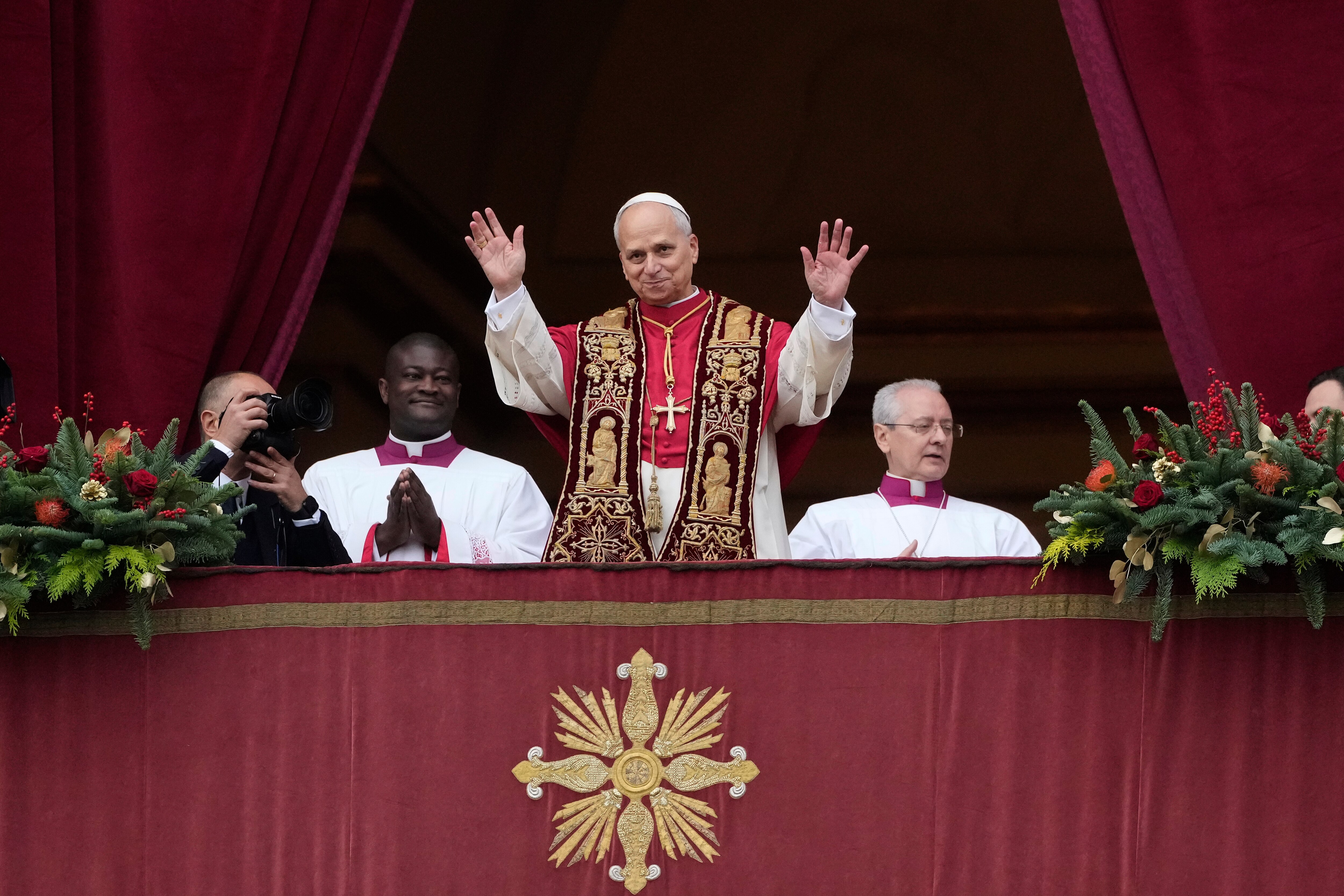 Pope Leo XIV waves after delivering the Urbi et Orbi (Latin for 'to the city and to the world' ) Christmas' day blessing from the main balcony of St. Peter's Basilica at the Vatican, Thursday, Dec. 25, 2025.