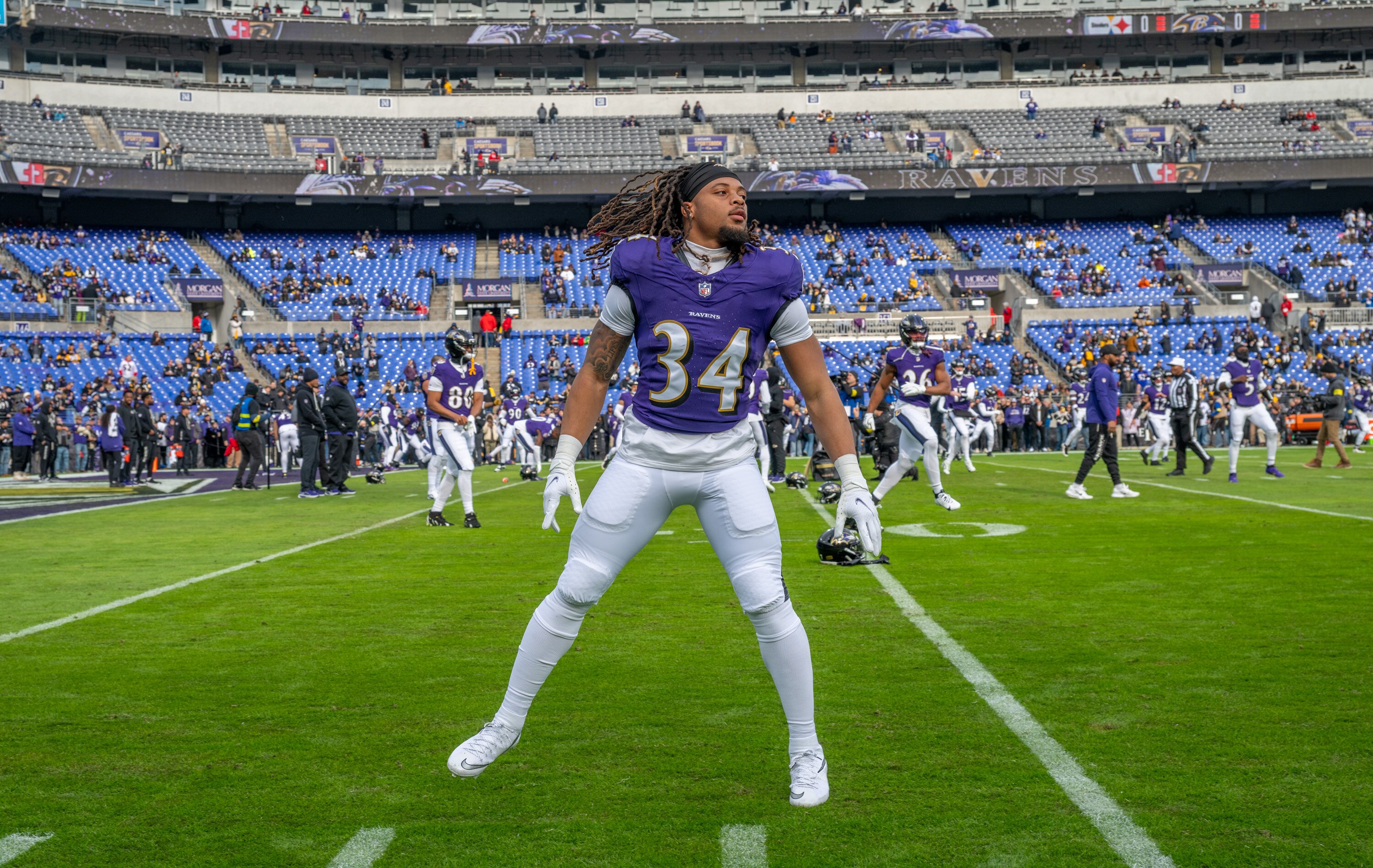 Ravens running back Keaton Mitchell (34) warms up prior to the team’s game against the Pittsburgh Steelers at M&T Bank Stadium.