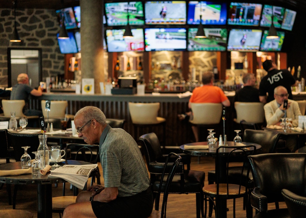 Guests sit near the bar at Laurel Park Race Track.