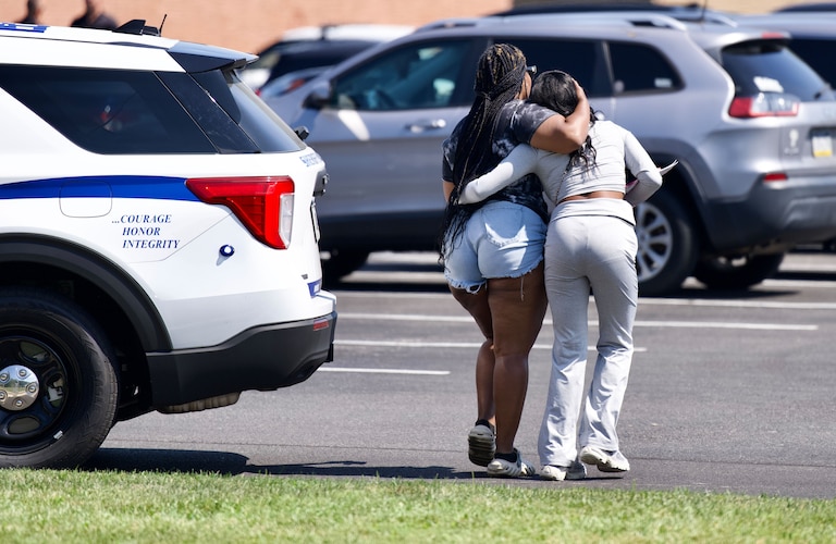 A guardian and student leave a reunification center near Joppatowne High School in Harford County, Friday, Sept. 6, 2024, after the sheriff's office and emergency personnel flocked to campus after a fight resulted in one student being injured.