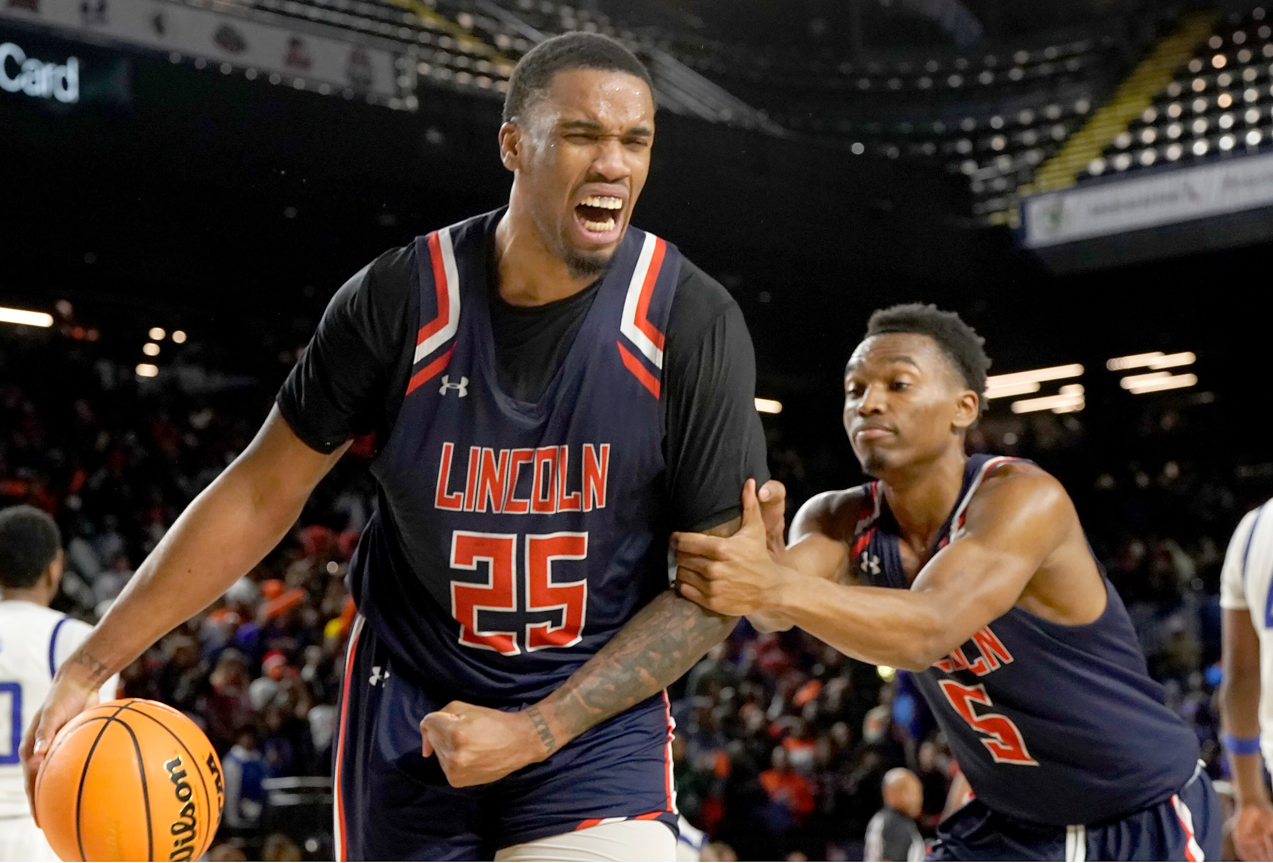 Peter Sober of Lincoln, who transferred from Morgan State, screams as he celebrates the Lions’ 54-51 win over Fayetteville State in Saturday's CIAA men’s championship game.