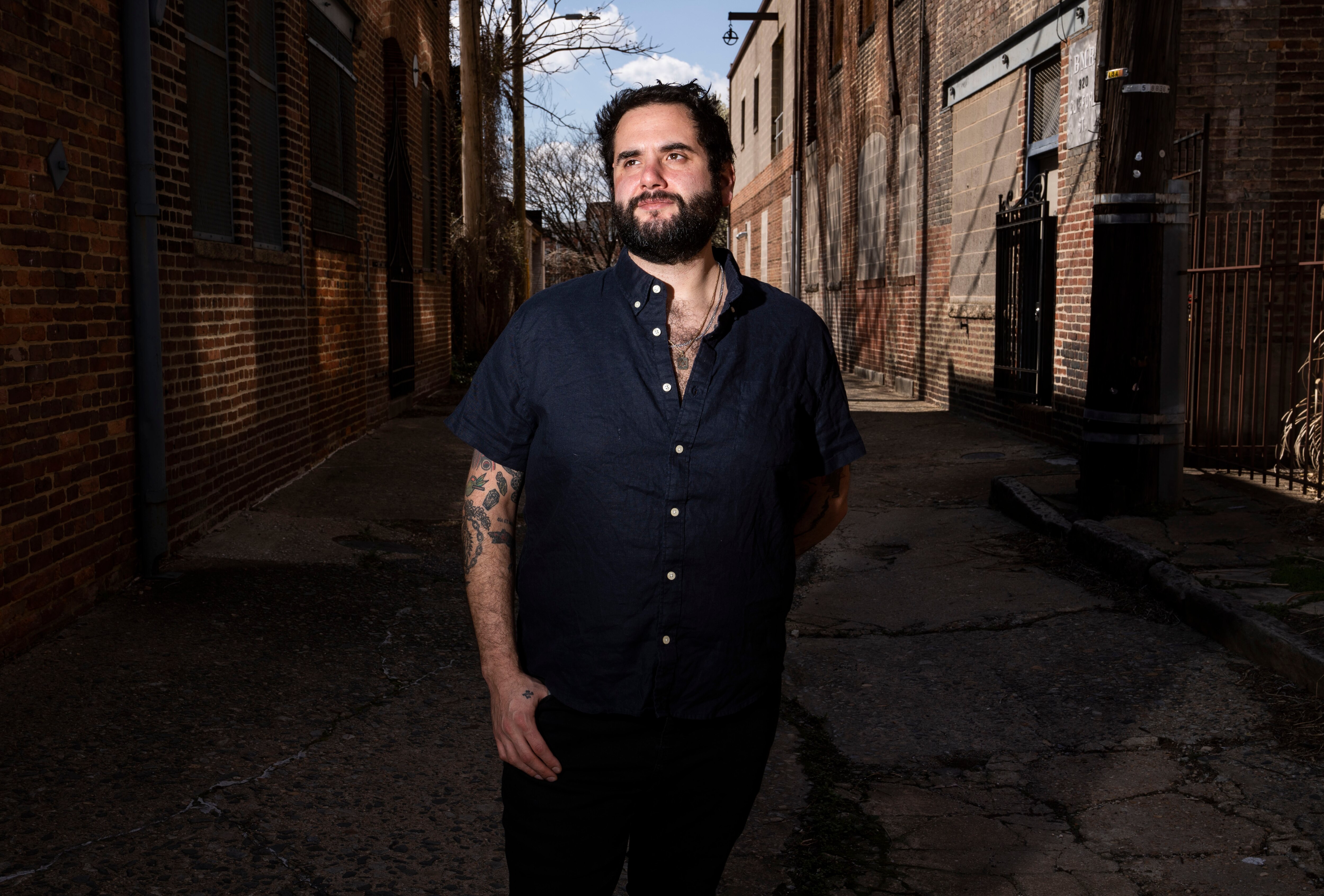 Michael Silver, a Pigtown resident, poses for a portrait in his neighborhood, Wednesday, March 29, 2023.