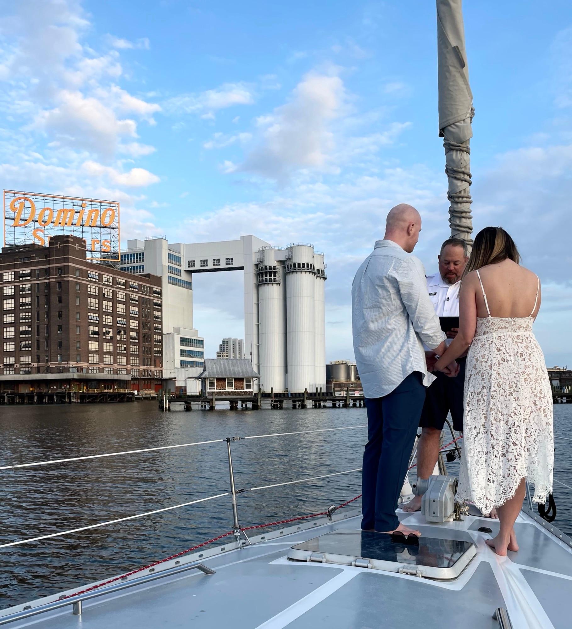 Paul Bozzo and Ellen Burke take vows on the Inner Harbor with Bobby LaPin presiding on April 25, 2024. (photo courtesy of Alicia Jones)