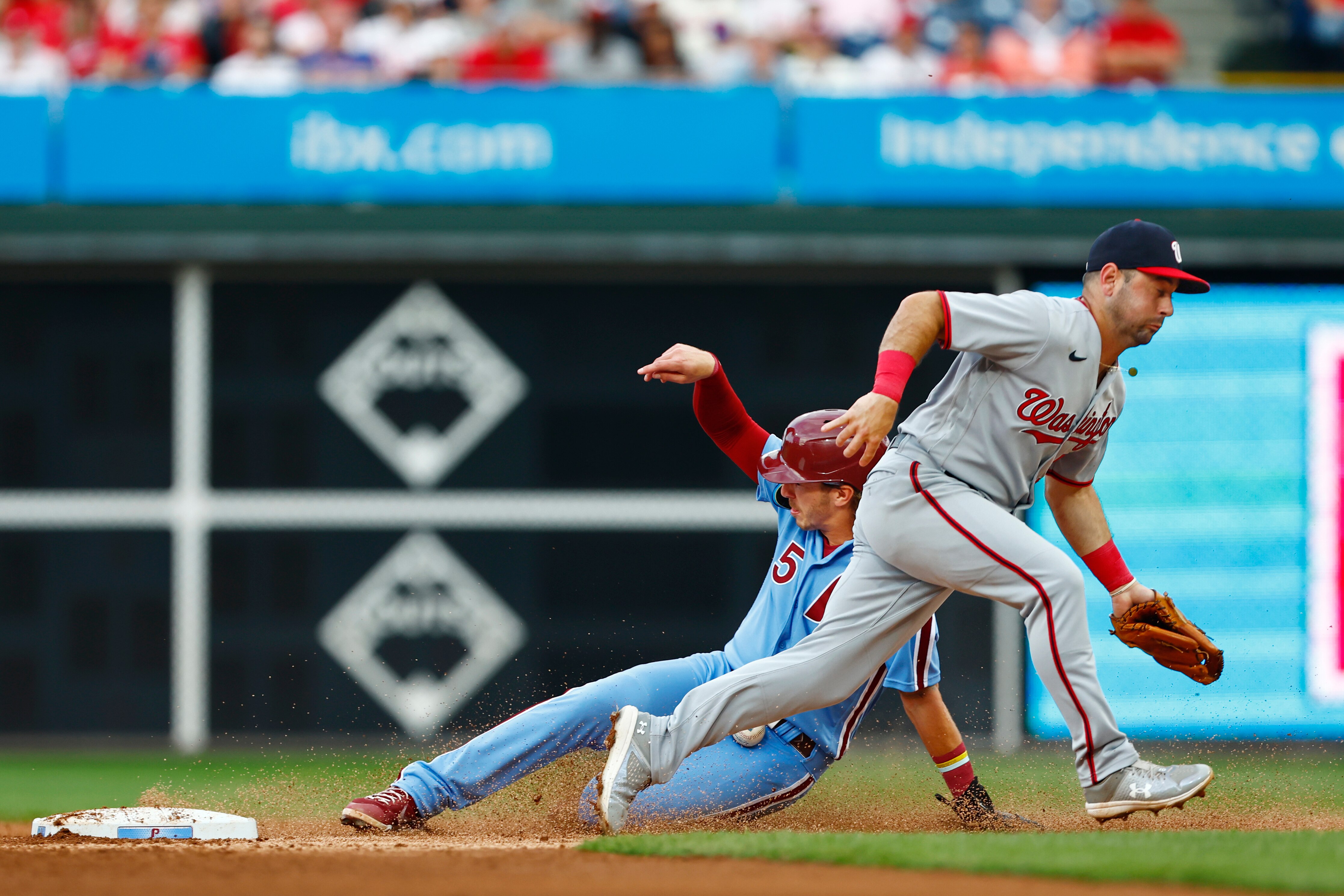 Bryson Stott of the Phillies steals second base as Jake Alu of the Nationals can't field the throw during the second inning.
