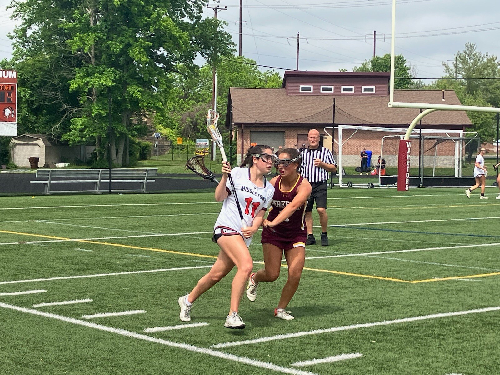 Middletown senior attacker Amy Grace Bizell is closely guarded by Hereford defender Lily Walton in a Class 2A state semifinal Saturday afternoon at Havre de Grace High School. Bizell and the Knights rolled to a 17-4 victory to advance to the title game against Manchester Valley.