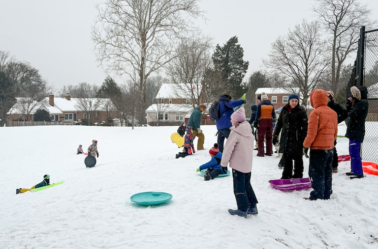 About two dozen kids and their parents found top-notch sledding in Pinecrest Park in the Woodmoor neighborhood of Silver Spring Sunday afternoon.