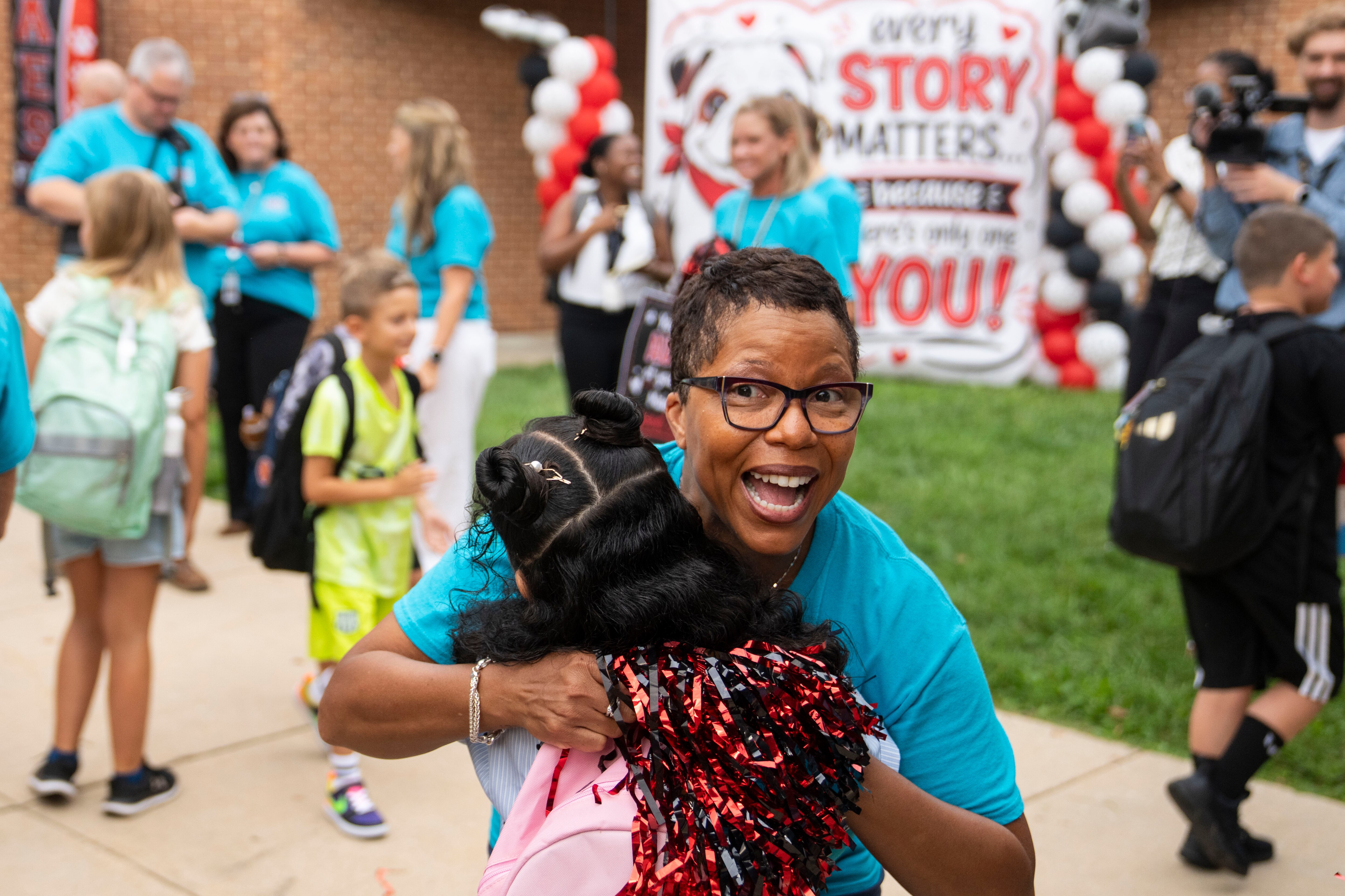 Superintendent Dyann Mack hugs a student on the first day of school at Bel Air Elementary School in Bel Air on Monday.