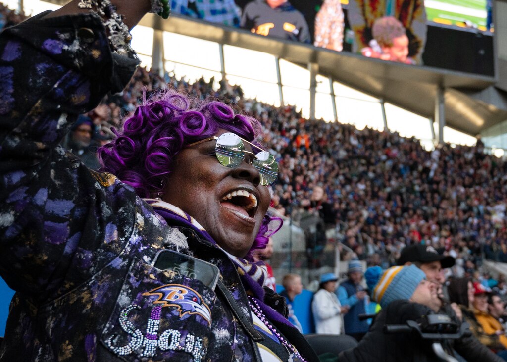 A Ravens fan from Baltimore celebrates in the final quarter of the Ravens game in Tottenham Hotspur Stadium on Oct. 15, 2023.