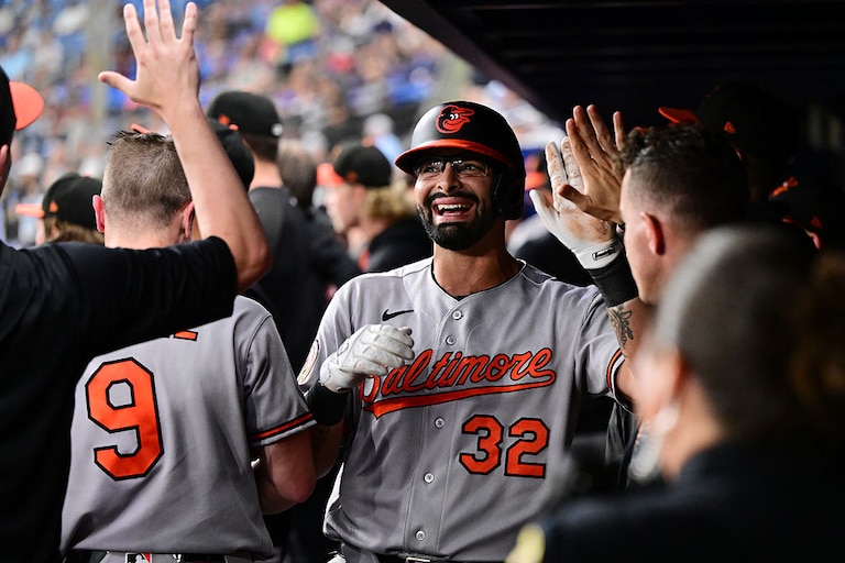 Christian Encarnacion-Strand celebrates with Orioles teammates after hitting a sacrifice fly to score Tyler O'Neill against the Tampa Bay Rays on Aug. 14.