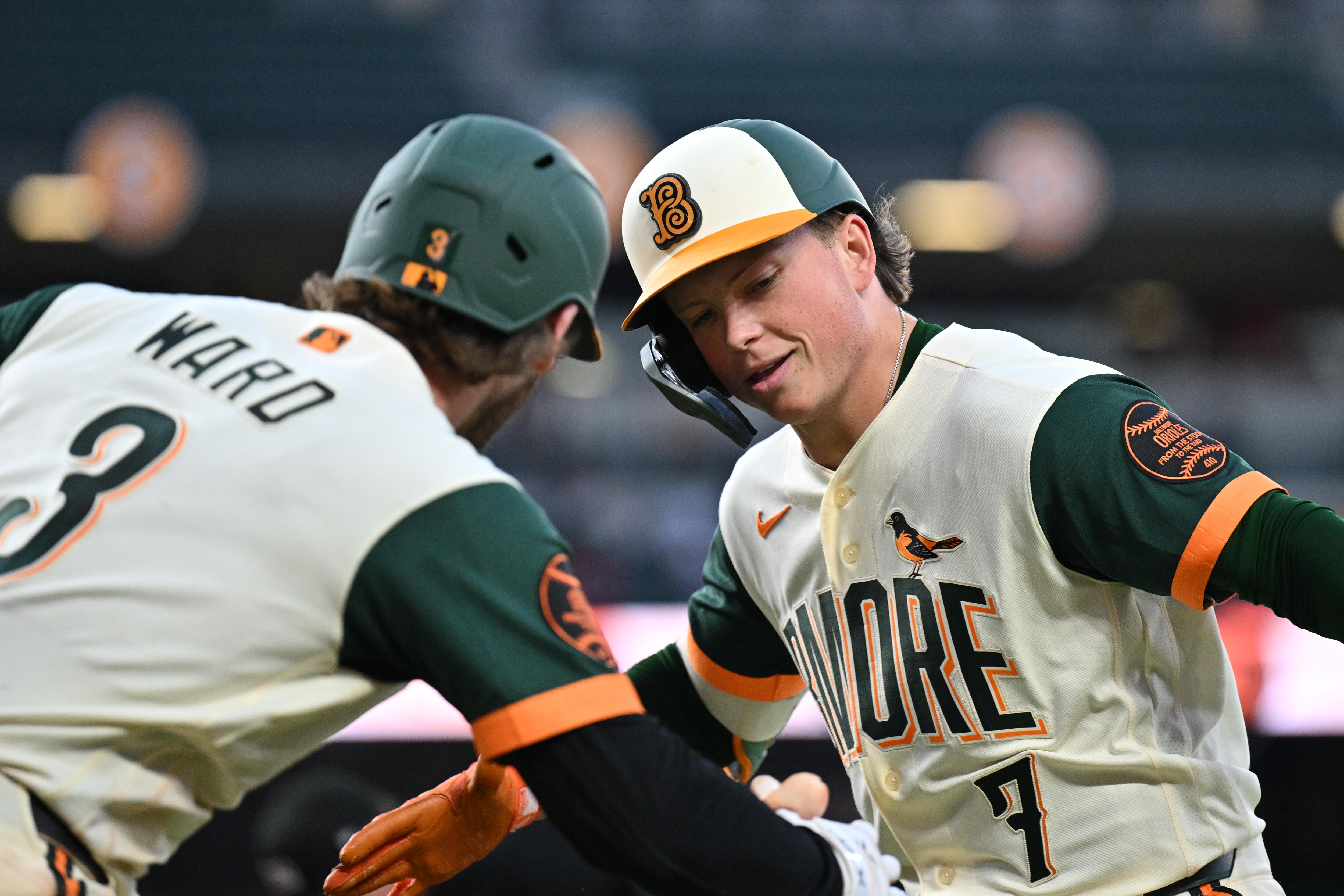 Jackson Holliday celebrates with Taylor Ward after hitting a home run in the fourth inning Friday night at Camden Yards.