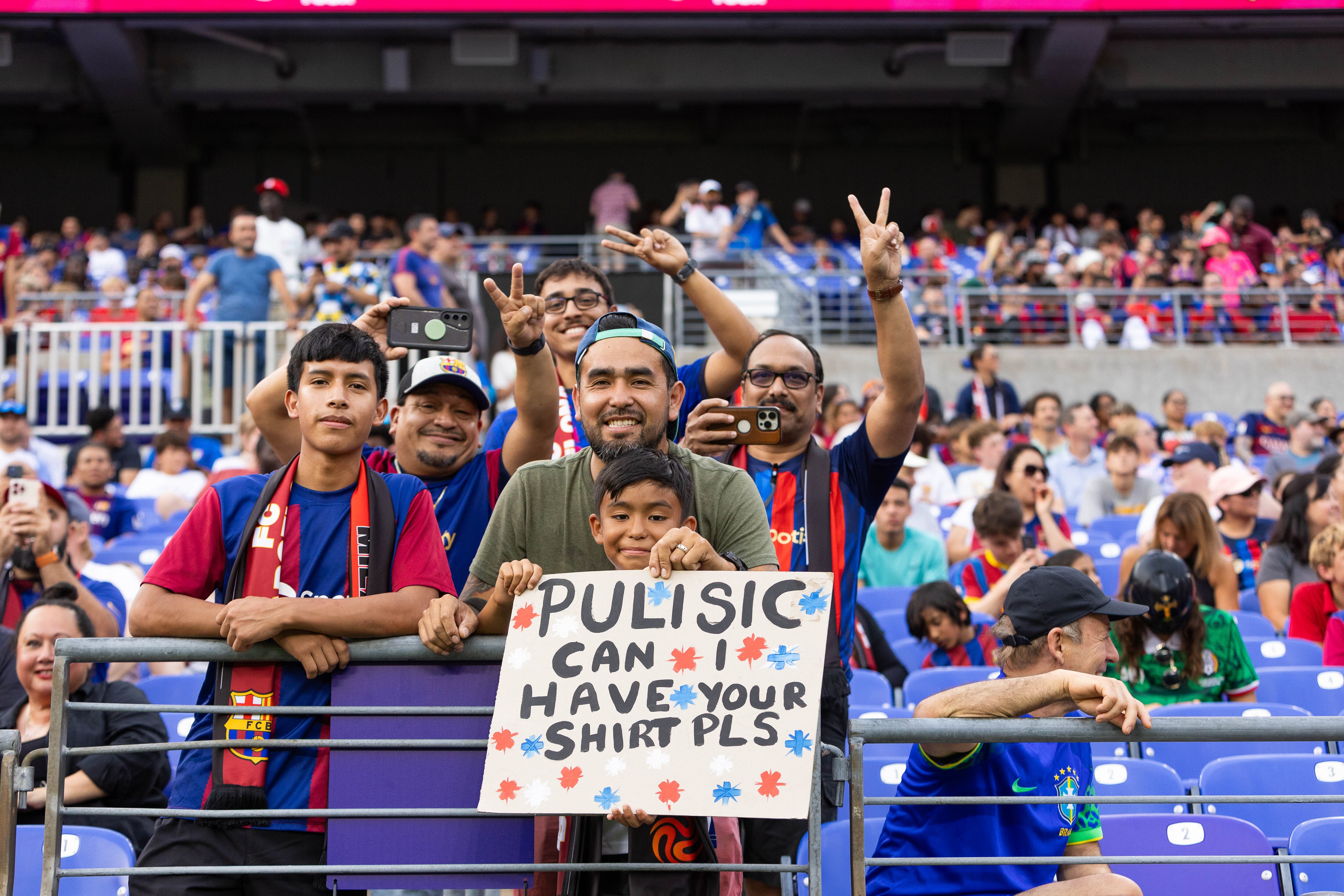 David Canal and his son Iker Canal, 11, showing their support for Christian Pulisic during a friendly match at M&T Bank Stadium.