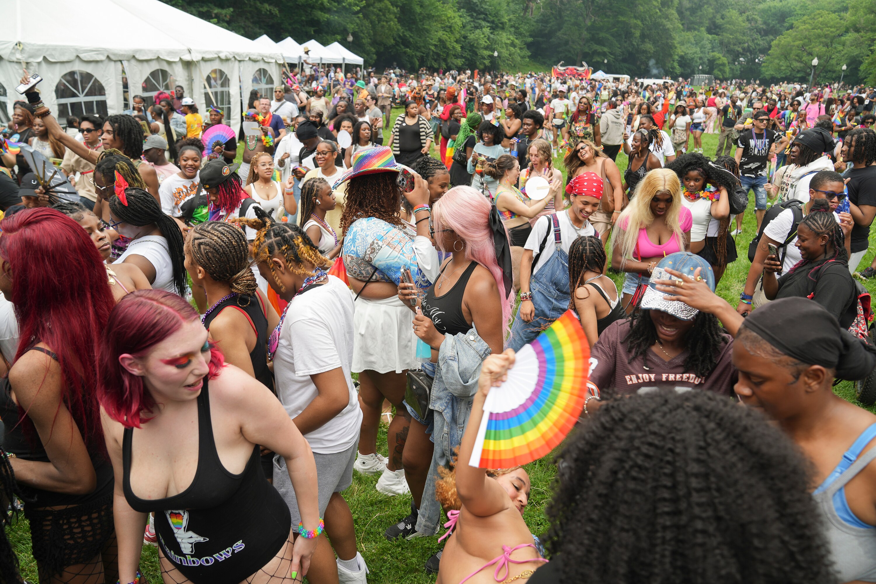 The audience dances to loud music being played at the Baltimore Pride block party at the 50th annual Baltimore Pride celebration in the Charles Village neighborhood of Baltimore on June 14, 2025.