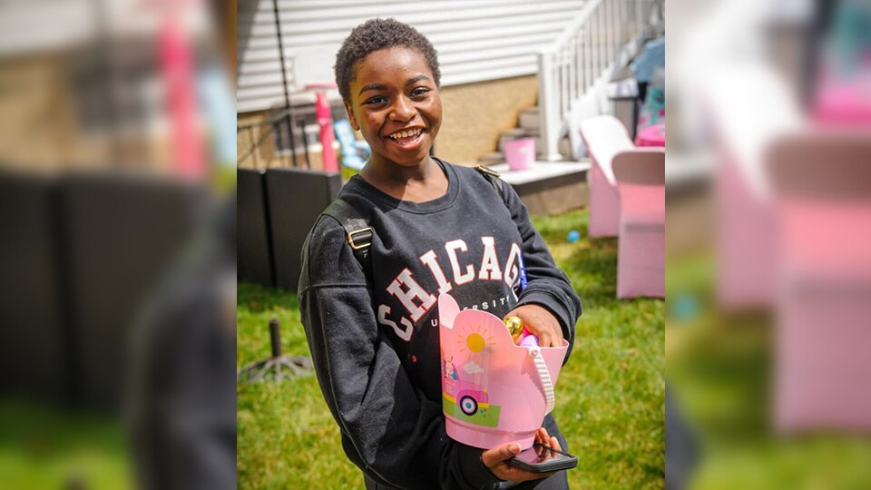 Tayzha Alona Warren, 12, holds an Easter basket during a gathering in April. (Photo courtesy of Mia Brooks)