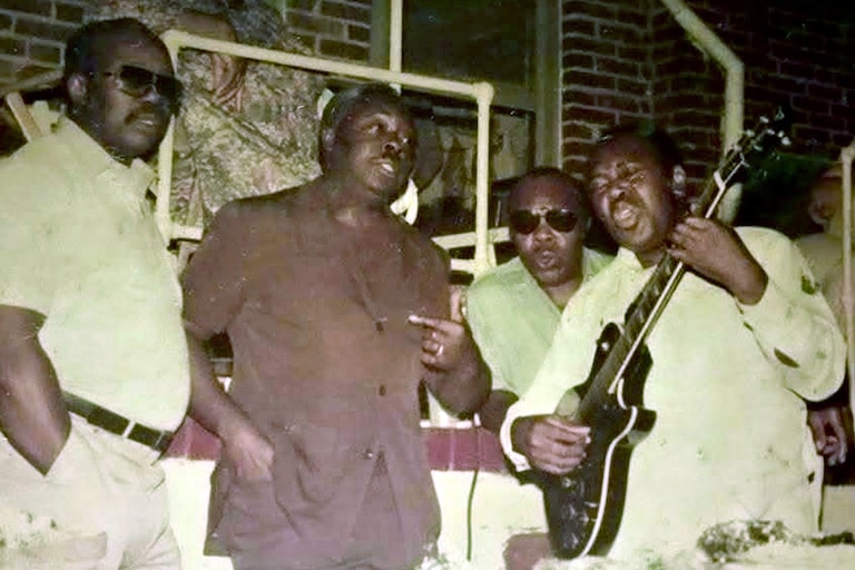 Rae Gaskins, second from left, with his brothers singing gospel music.