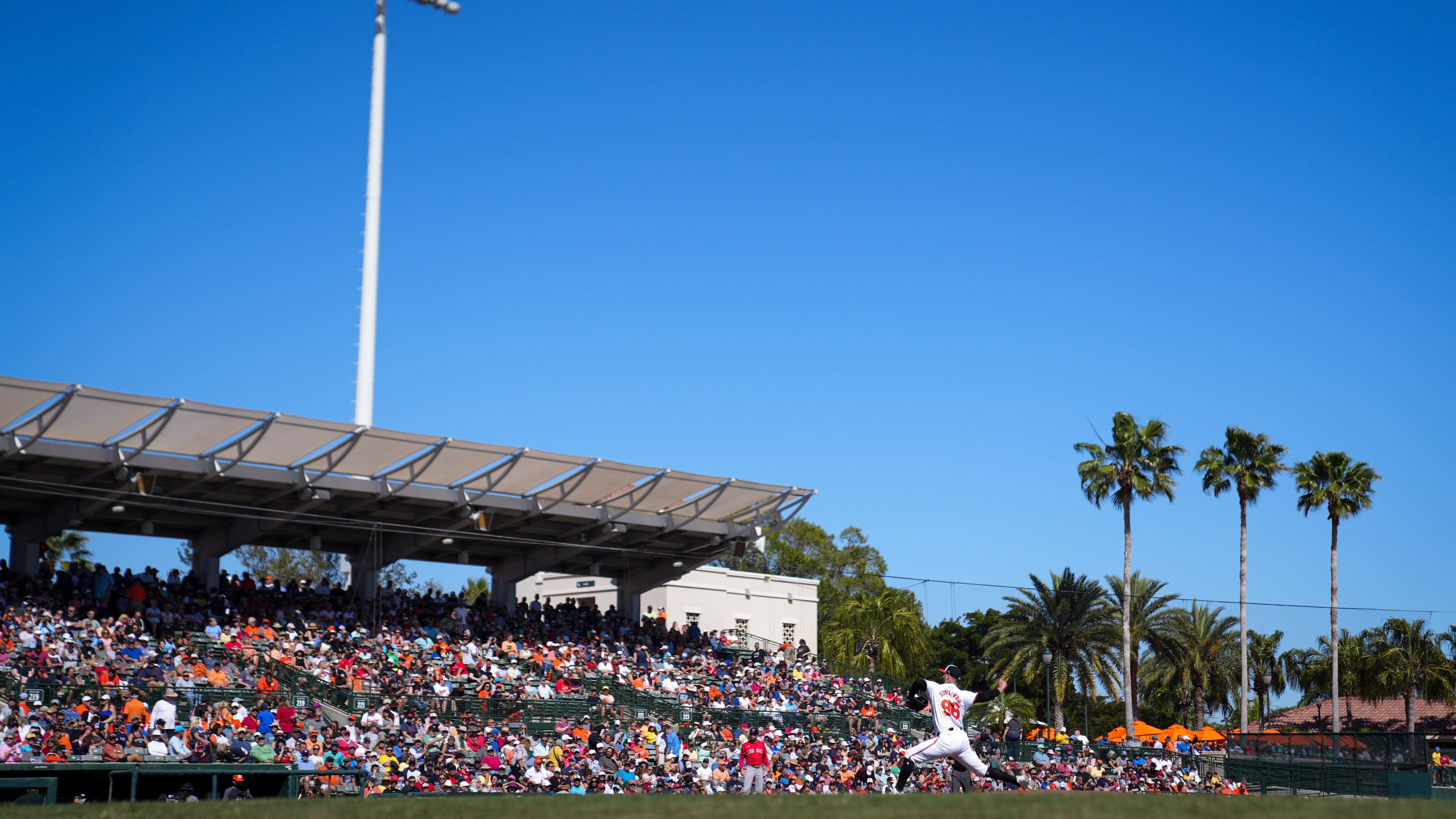Baltimore Orioles pitcher Garrett Stallings (96) pitches in the team’s home opener against the Boston Red Sox at Ed Smith Stadium on February 24, 2024. The Orioles beat the Red Sox, 4-3, in the Grapefruit League game.