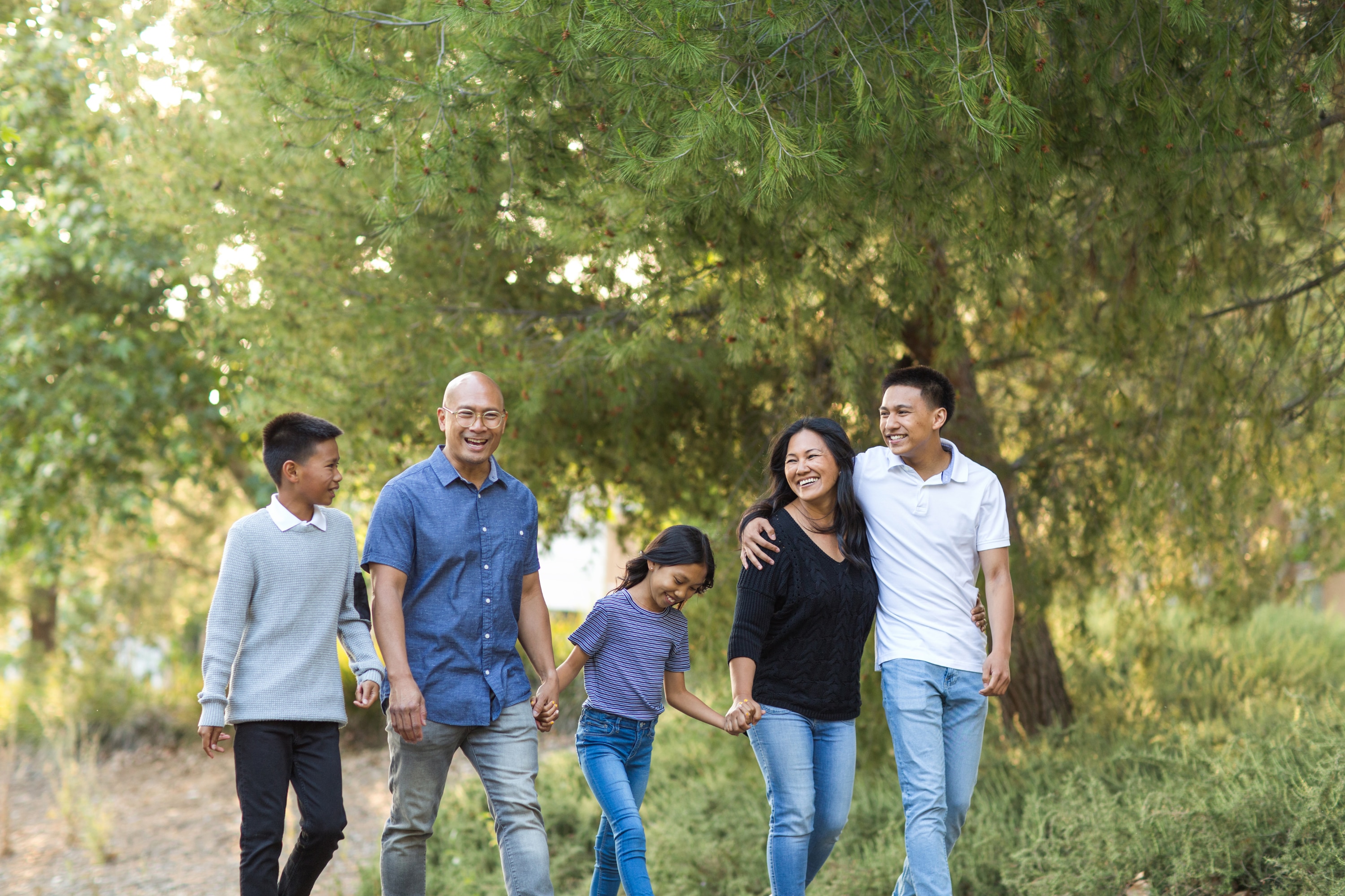 Walking together, planning ahead: A Maryland family enjoys a day in the park, knowing a Special Needs Trust can help safeguard their child’s future while preserving vital benefits like Medicaid, SSI, and housing support. With FMDT, peace of mind for tomorrow begins with planning today.