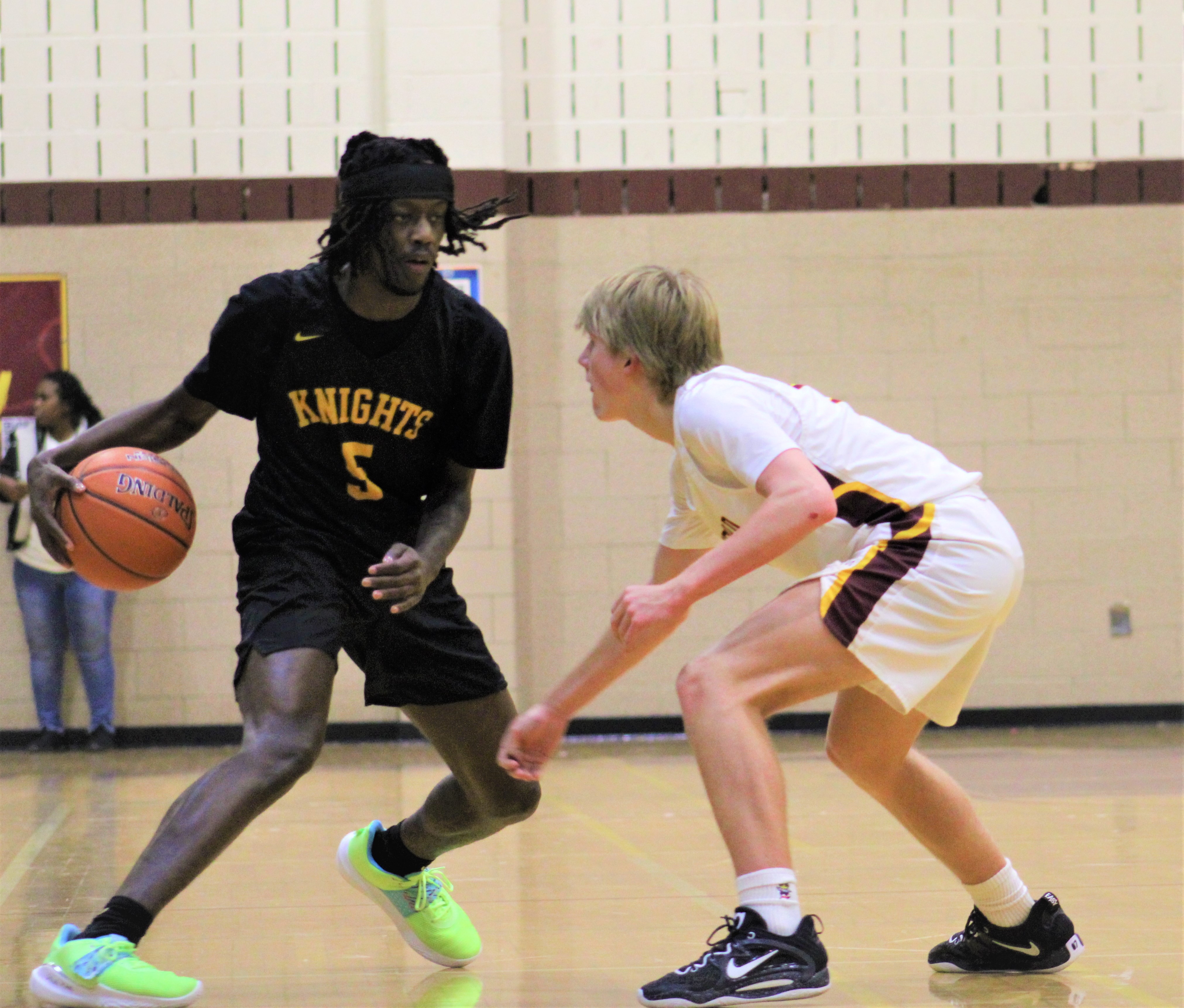 Parkville's Caron Smith is defended by Hereford's Sam Nicholson during Friday's Baltimore County boys basketball contest. Smith scored a game-high 18 points as the No. 3 Knights remained undefeated with a 64-40 victory over the 14th-ranked Bulls in Parkton.