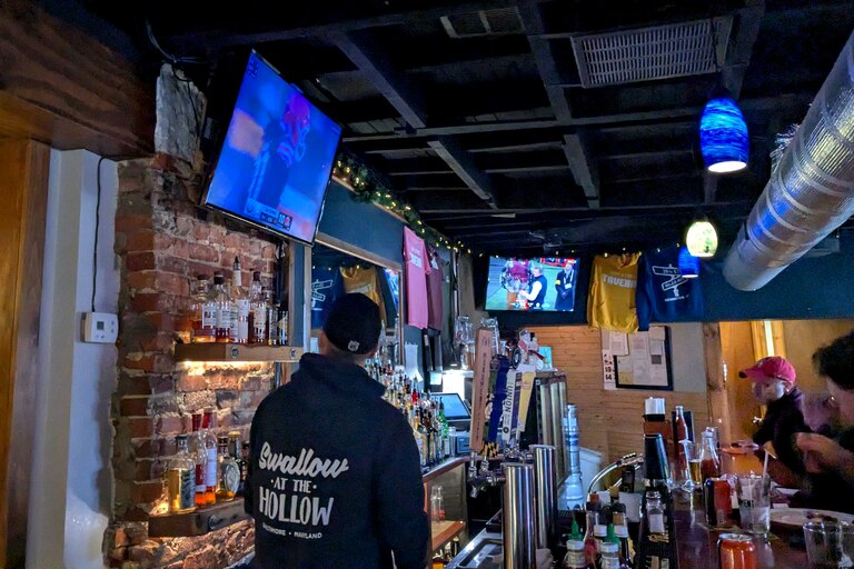Patrons at the 29th Street Tavern watch the first half of the Browns-Steelers game on Sunday.