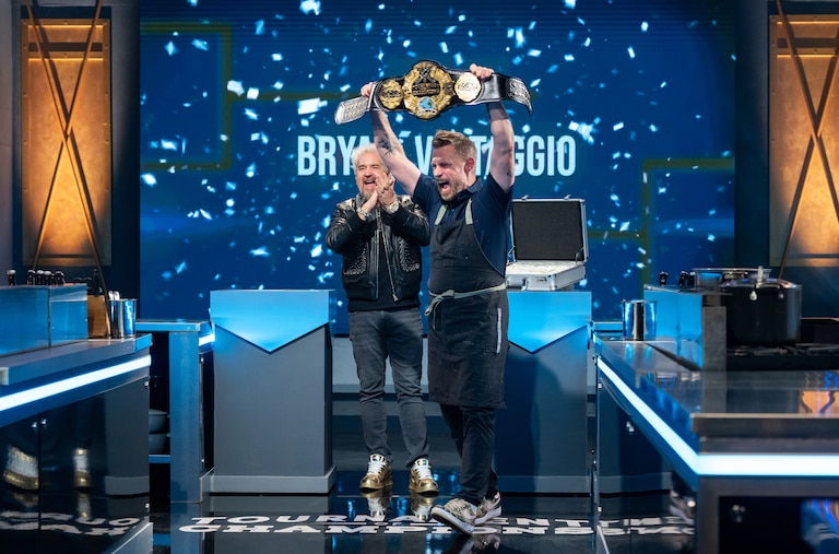 Host Guy Fieri and contestant Bryan Voltaggio reacts as he is announced the Tournament of Champions, Season 7 winner, as seen on Tournament of Champions, Season 7.