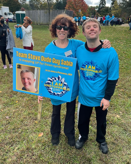 Ricki and Steve Sabia pose together a 2023 Step Up for Down syndrome walk.