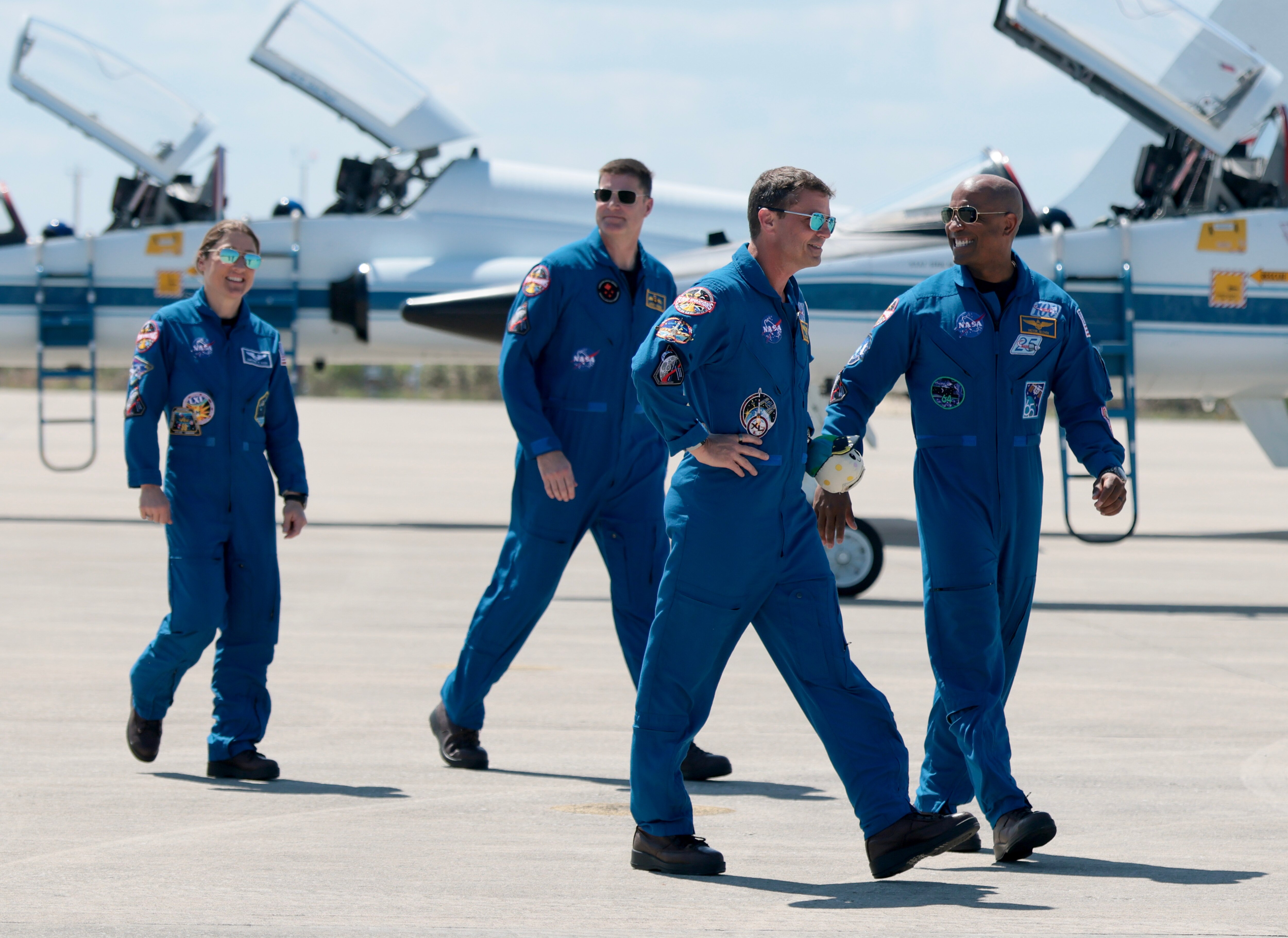 The Artemis II crew, from left, mission specialist Christina Koch, mission specialist Jeremy Hansen of CSA (Canadian Space Agency), commander Reid Wiseman, and pilot Victor Glover – arrive at the Kennedy Space Center on March 27, 2026 in Cape Canaveral, Florida.