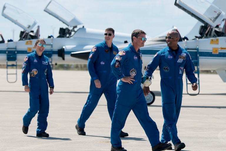 The Artemis II crew, from left, mission specialist Christina Koch, mission specialist Jeremy Hansen of CSA (Canadian Space Agency), commander Reid Wiseman, and pilot Victor Glover – arrive at the Kennedy Space Center on March 27, 2026 in Cape Canaveral, Florida.